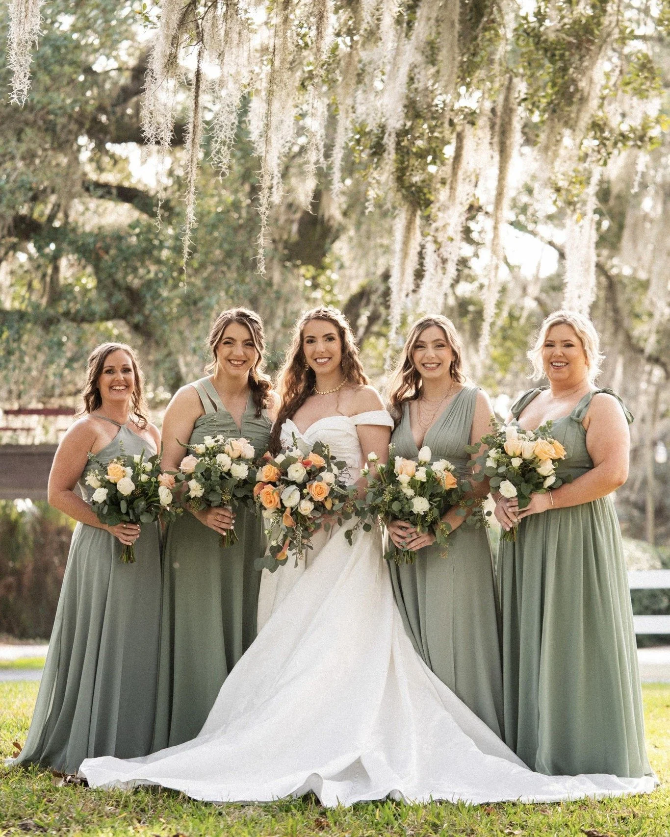 Surrounded by the friends who have walked beside her through every season of life, this is one of those quiet moments that tells the whole story of a wedding day. Beneath the moss draped trees at Bowing Oaks, laughter comes easily, nerves fade away, 
