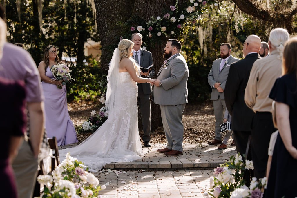 Lavender in bloom, soft gray accents, and a setting that lets every detail feel intentional.

This spring wedding at Bowing Oaks embraced a palette that was equal parts romantic and refined. The flowing lavender dresses, the tailored gray suits, and 