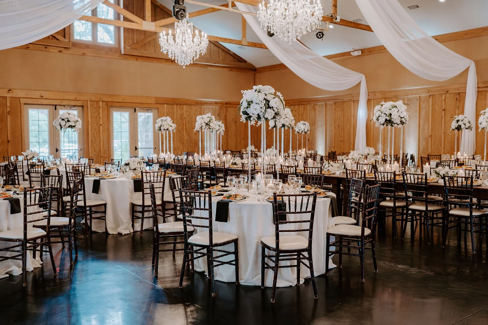 Ready for the celebration to begin. ✨

There is something special about seeing the Bowing Oaks ballroom completely transformed for a wedding reception. Tables are set, candles are glowing, flowers are perfectly placed, and every detail is ready to we