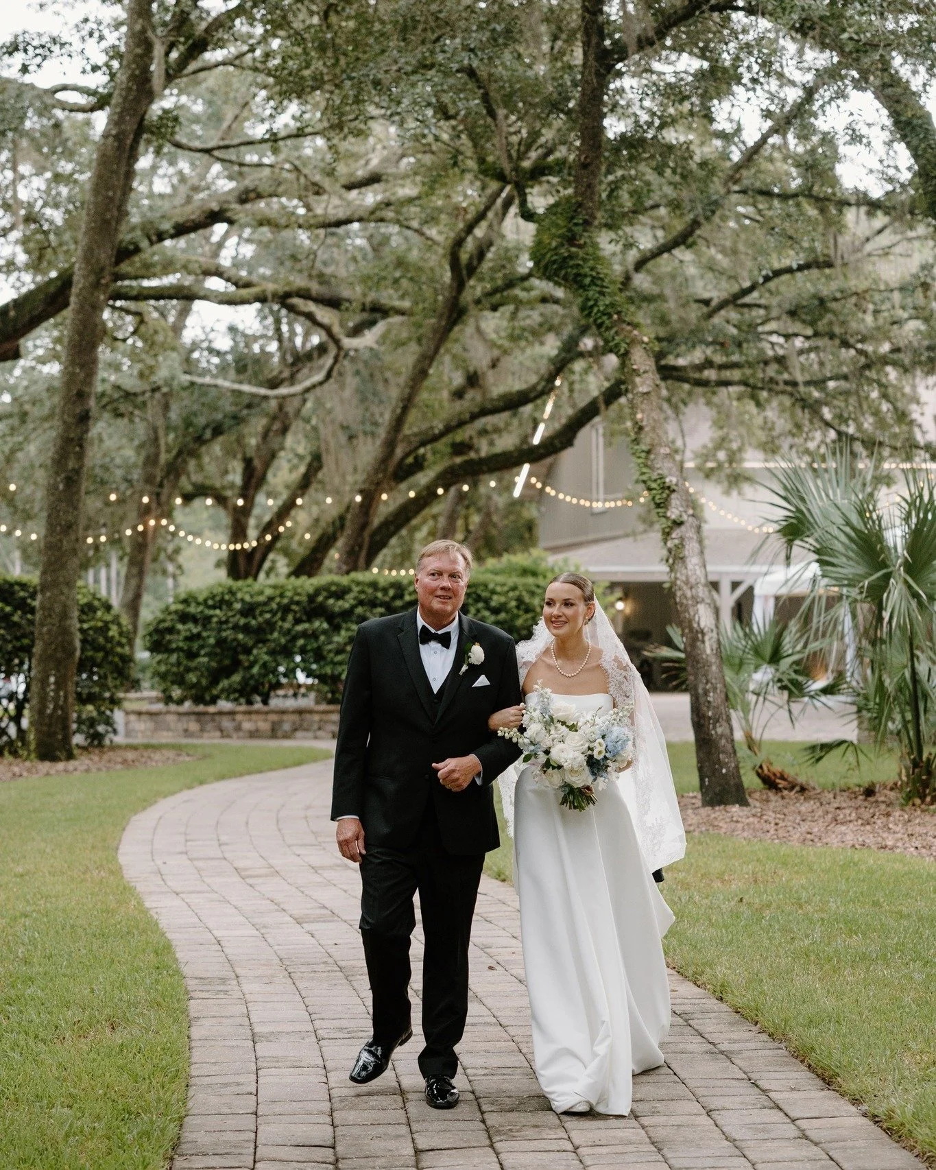 A little rain couldn't dampen K&amp;Z's wedding, and we're so grateful it didn't! 

The weather cleared just long enough for the bride and her father to take that special walk to the ceremony pavilion, surrounded by lush greenery and vibrant flowers.