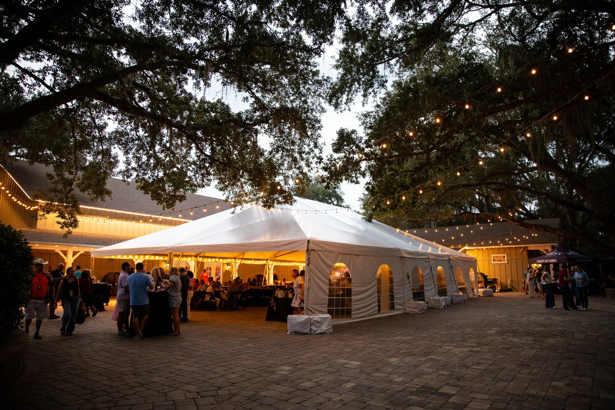One of the things we love about the patio at Bowing Oaks is just how much space it offers. Even with a large tent set up for an event, there&rsquo;s still plenty of room for guests to mingle, enjoy the fresh air, and gather beneath the oak trees and 