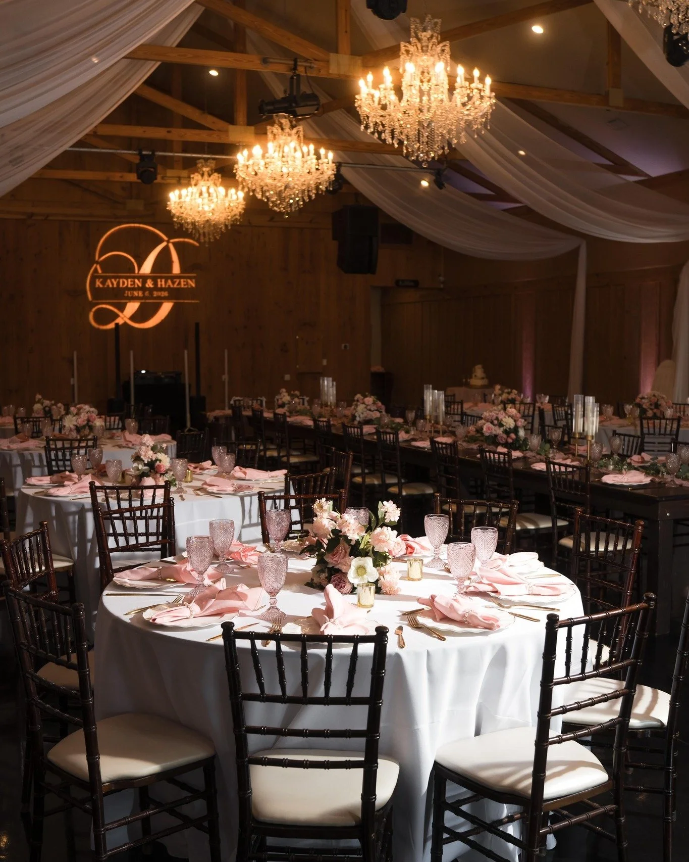 Soft pinks, crisp whites, and romantic florals set the tone for this beautiful spring wedding at Bowing Oaks. From the blush napkins and textured glassware to the delicate centerpieces, every detail came together to create a reception that felt fresh