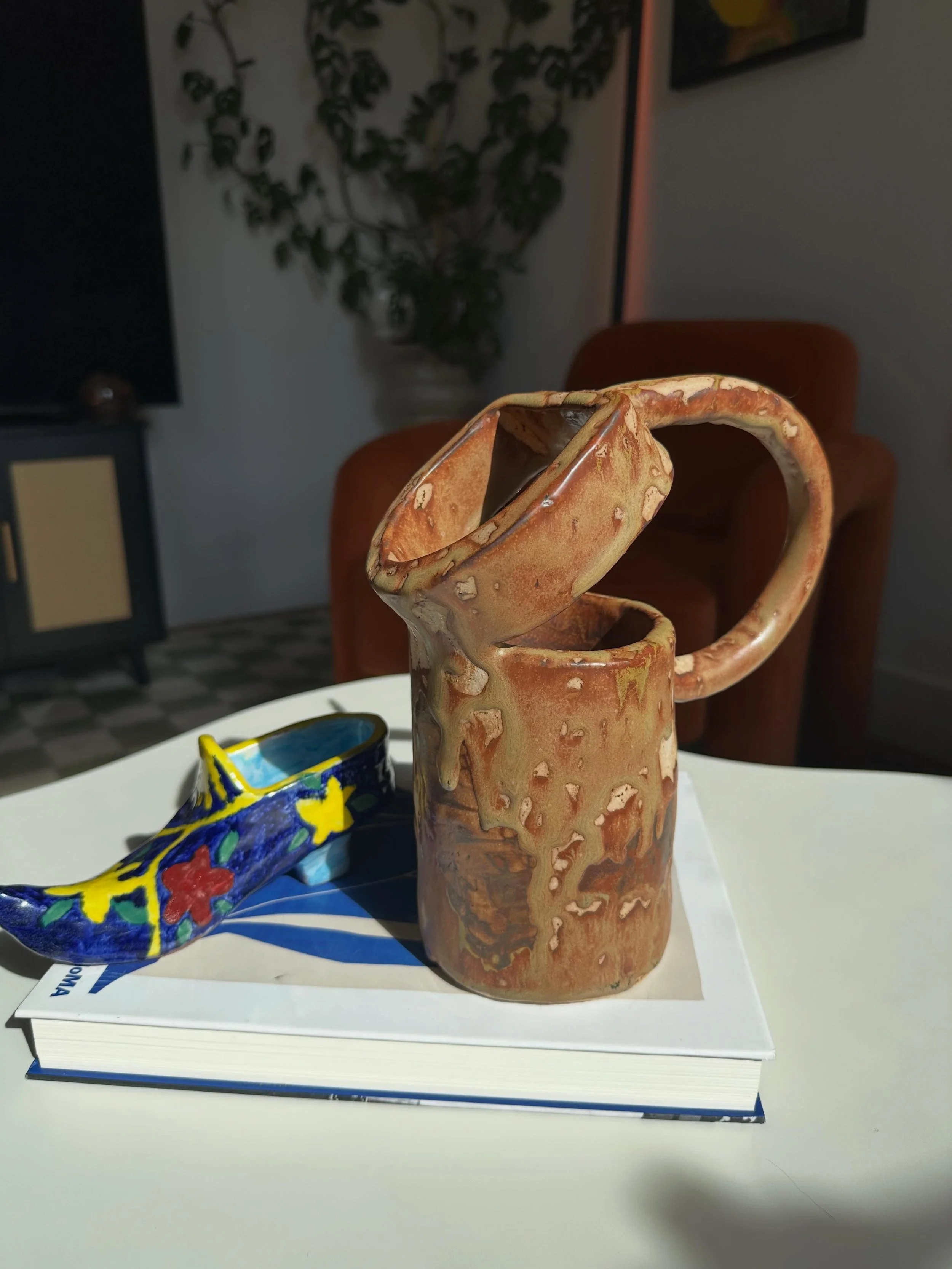 a primitive water pitcher i made that i dont use for water, but instead use for making my coffee table look cool &amp; contemporary