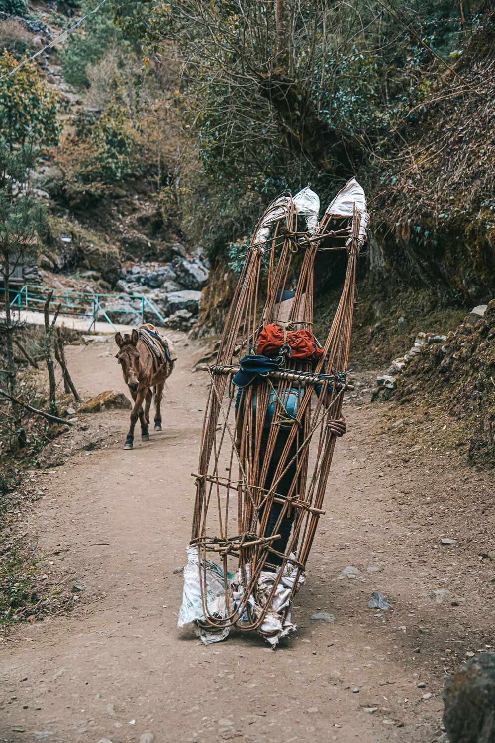 Porters have to carry very heavy loads for Everest summit expeditions.