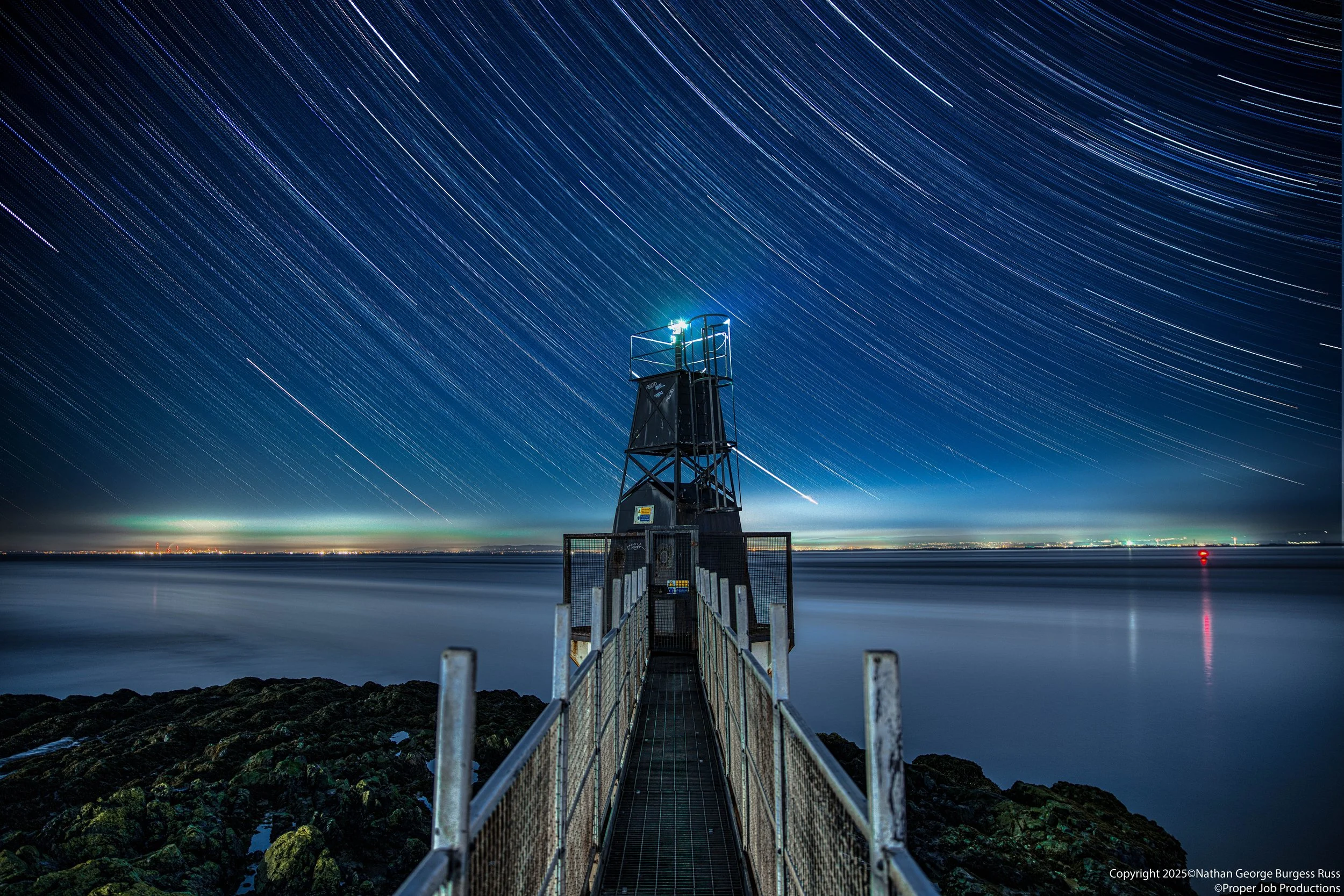 Star Trails above Battery Point Lighthouse.

Battery Point Lighthouse was built by the Chance Brothers of Smethwick for the Bristol Port Company in 1931. The Lighthouse is 30ft tall and constructed of a concrete base with a black metal pyramid, toppe