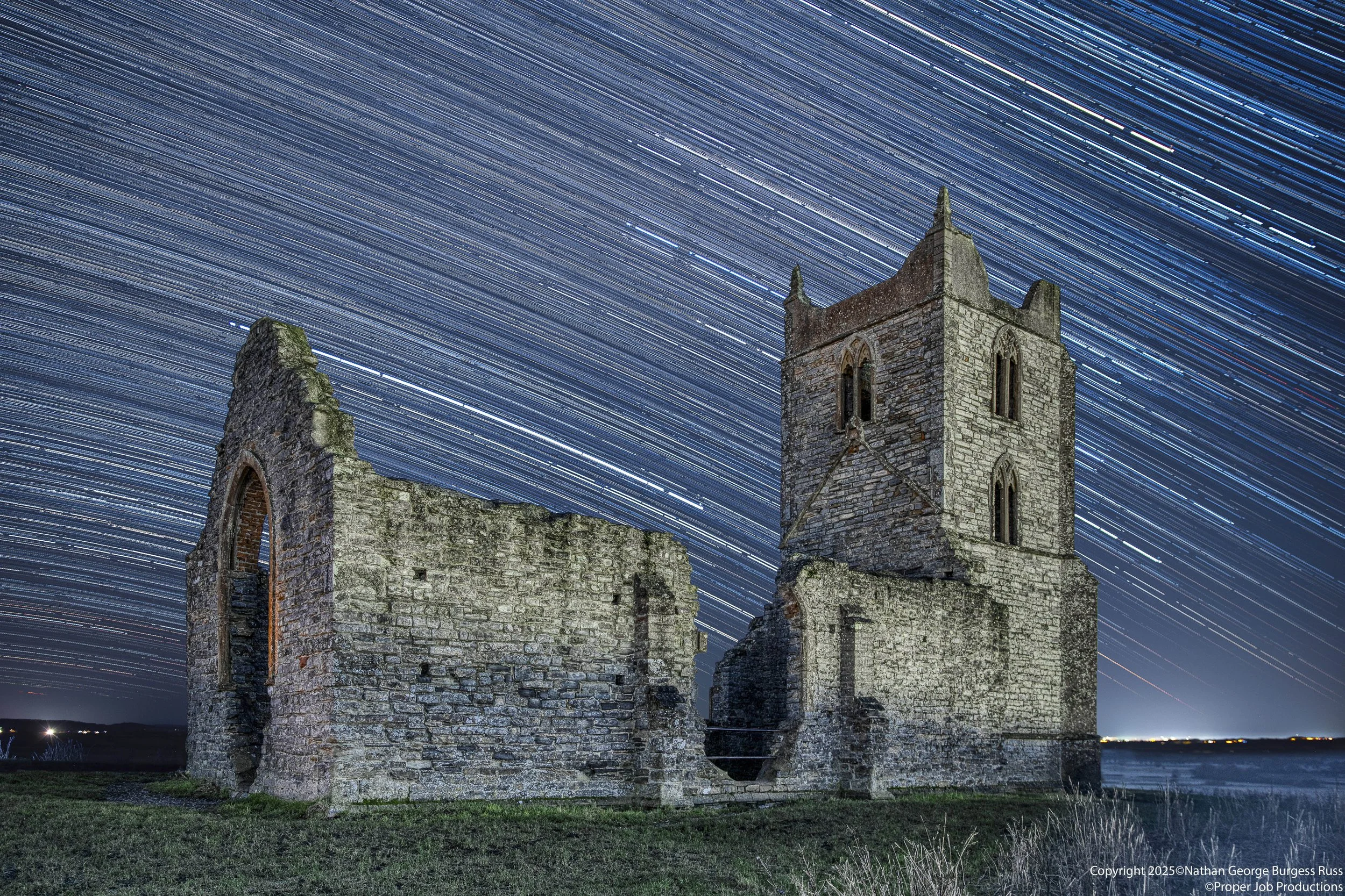 A star trail of the ruins of Saint Michaels Church from the side.

Saint Michaels was originally built on Burrow Mump sometime in the mid 1400's, above the hamlet of Burrowbridge. In the English Civil Wars it was used as a sanctuary for royalists. Du