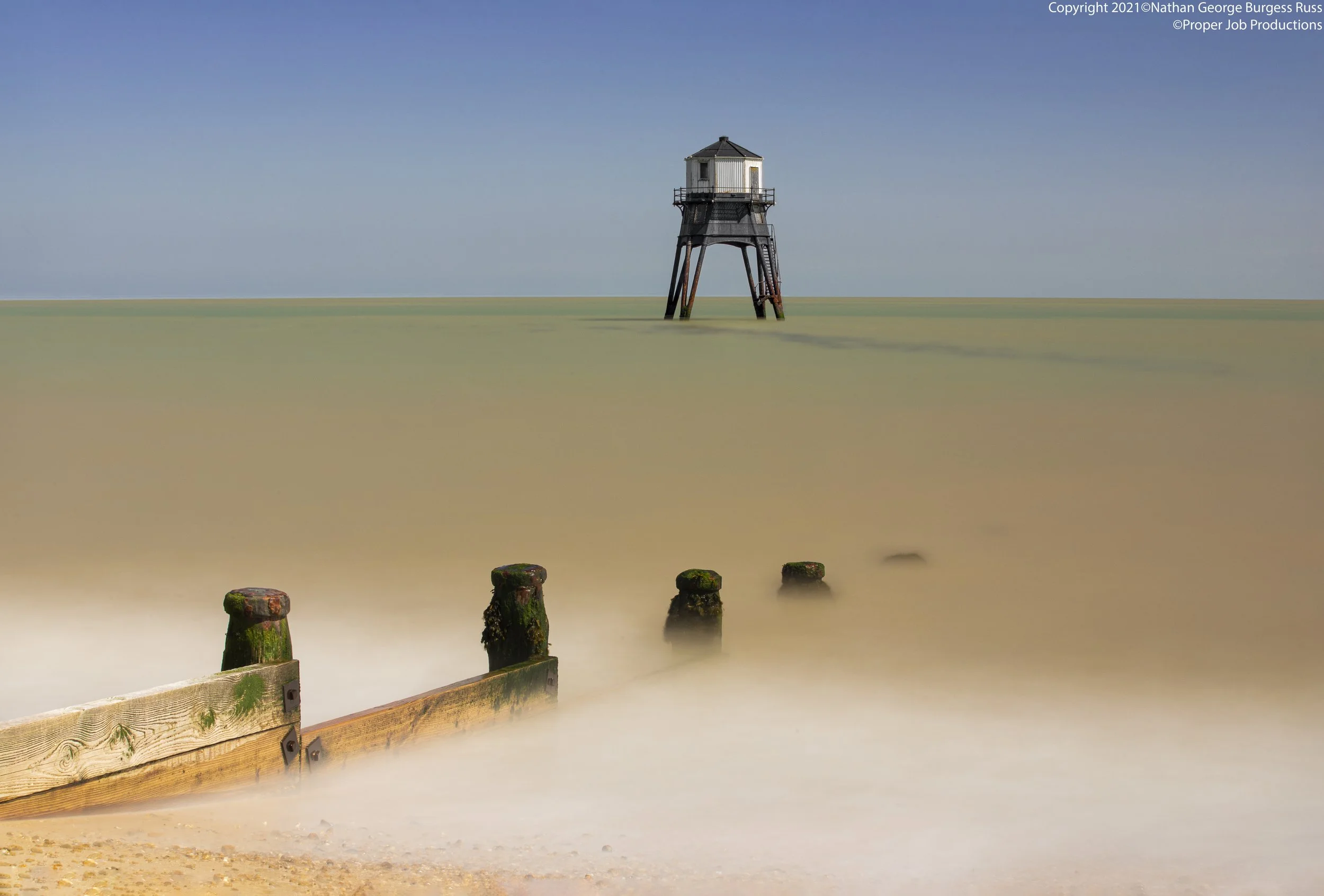 120 second long exposure of Dovercourt Low Lighthouse and with one of the Groynes at high tide.

The Dovercourt Low lighthouse and High Lighthouse were built as a pair by Trinity House in 1863,
both lighthouses are built in the same hexagonal shaped 