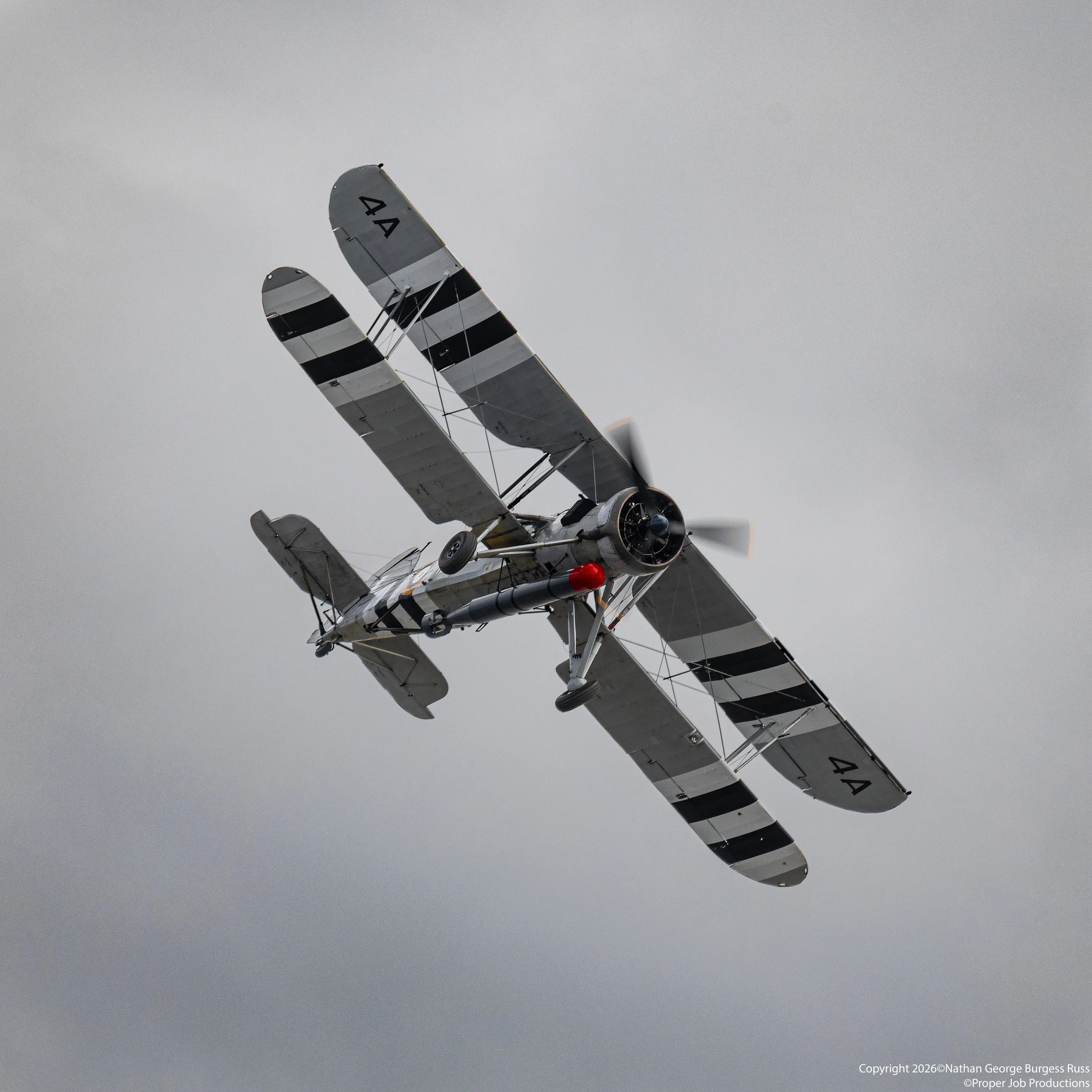 Fairey Swordfish MkI W5856 carrying a 18" torpedo.

W5856 is currently painted to represent the Fleet Air Arms 820 Naval Air Squadron with Invasion Stripes.

This Fairey Swordfish is the oldest Swordfish still in existence having first flown on the 2