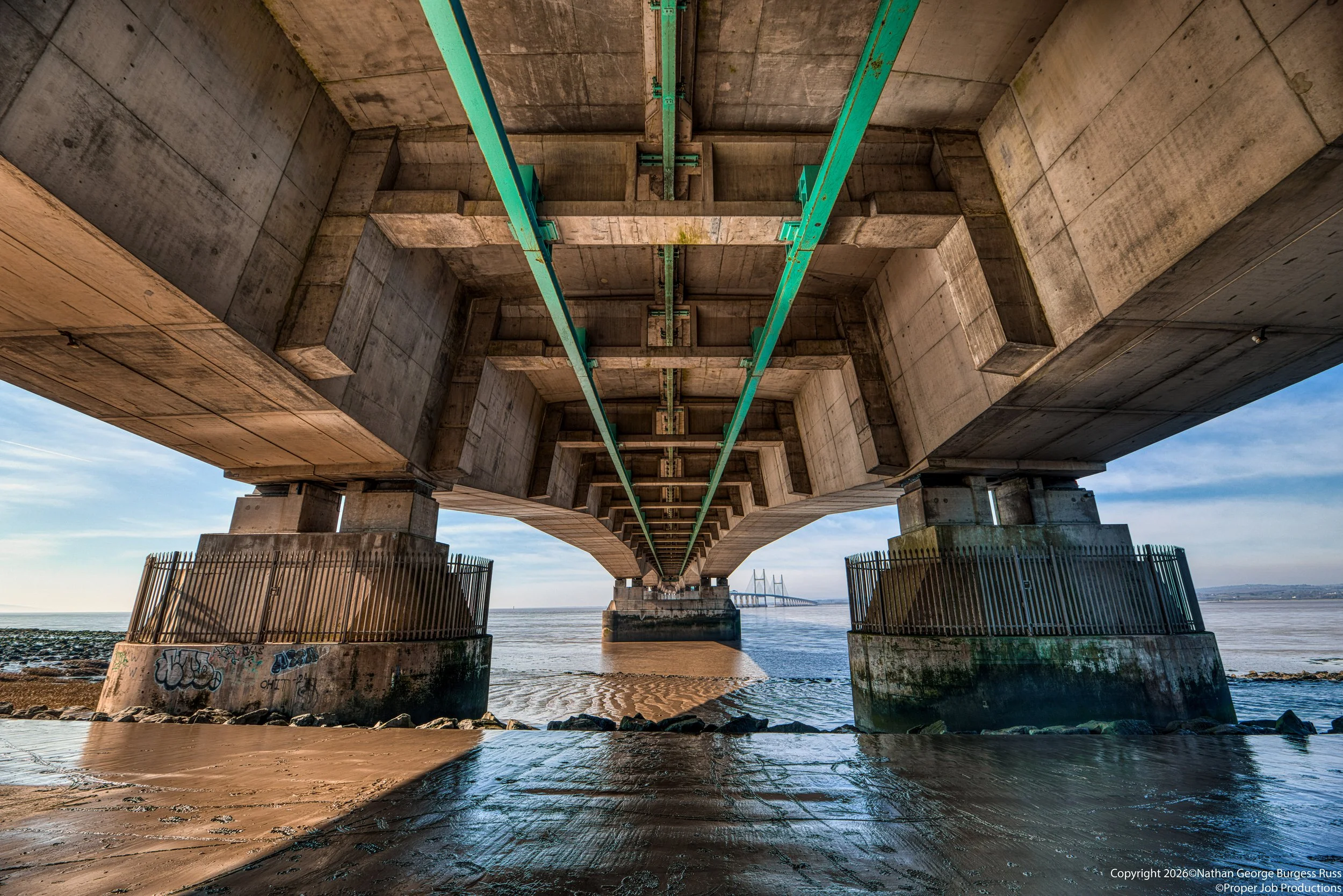 The underside of the Prince of Wales Bridge (Pont Tywysog Cymru), formerly known as the Second Severn Crossing (Ail Groesfan Hafren). 

The Bridge opened in 1996 to carry the M4 over the River Severn Estuary, to relieve the traffic on the first Sever