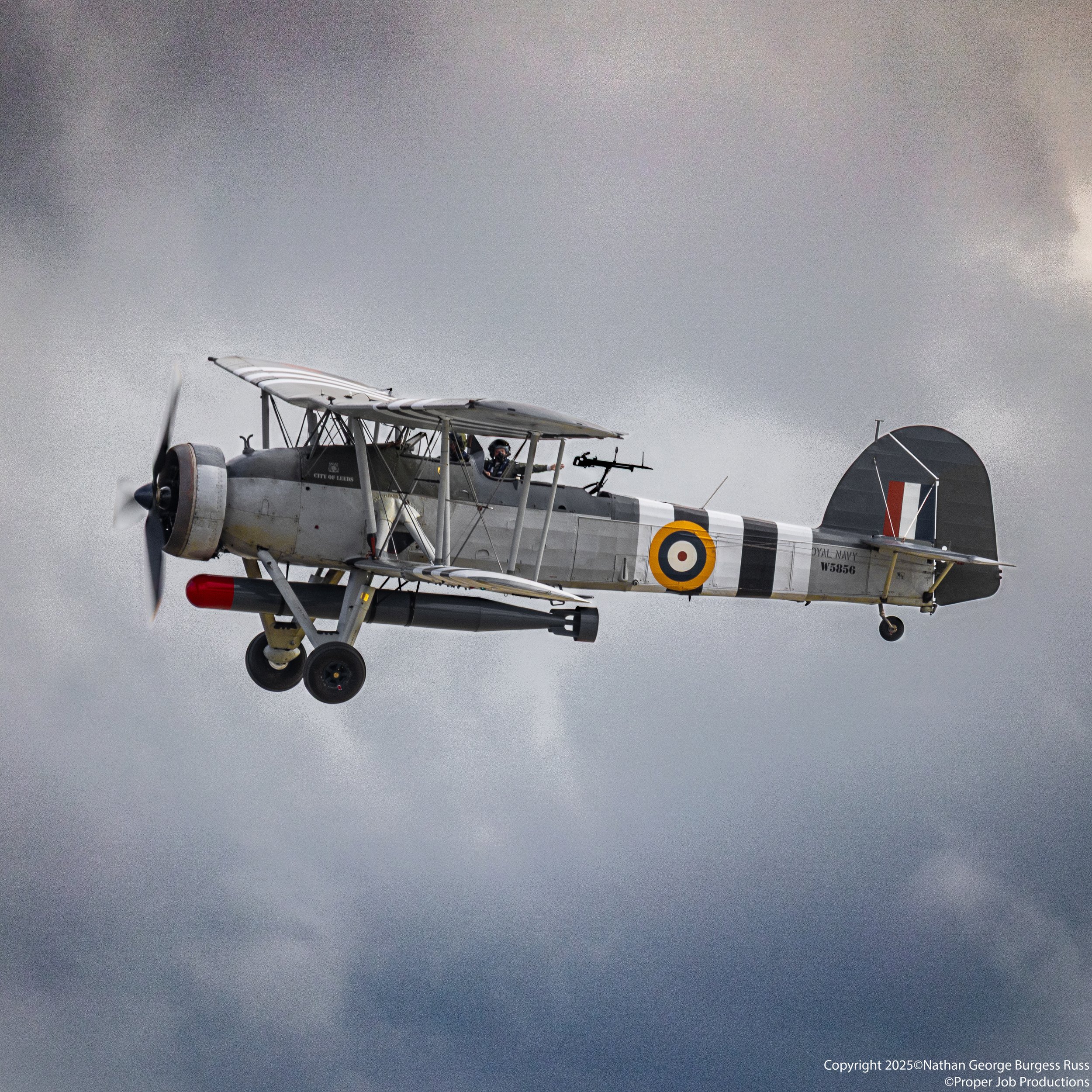 Fairey Swordfish MkI W5856 carrying a 18" torpedo.

W5856 is currently painted to represent the Fleet Air Arms 820 Naval Air Squadron with Invasion Stripes.

This Fairey Swordfish is the oldest Swordfish still in existence having first flown on the 2