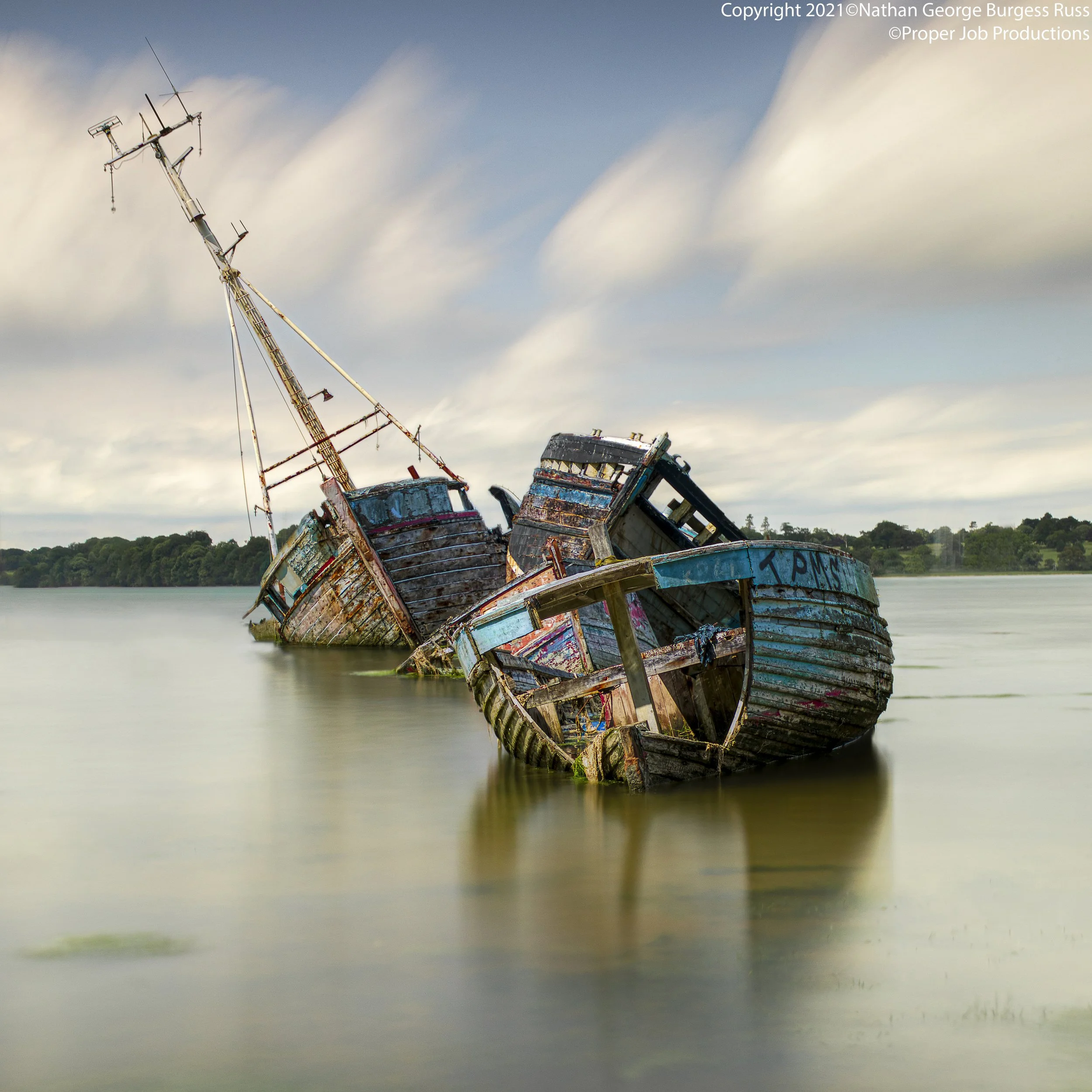 Four Wooden hulled boats in various states of decay in the Pin Mill Boatyard Graveyard. Pin Mill is a hamlet situated on the banks of the River Orwell, Suffolk