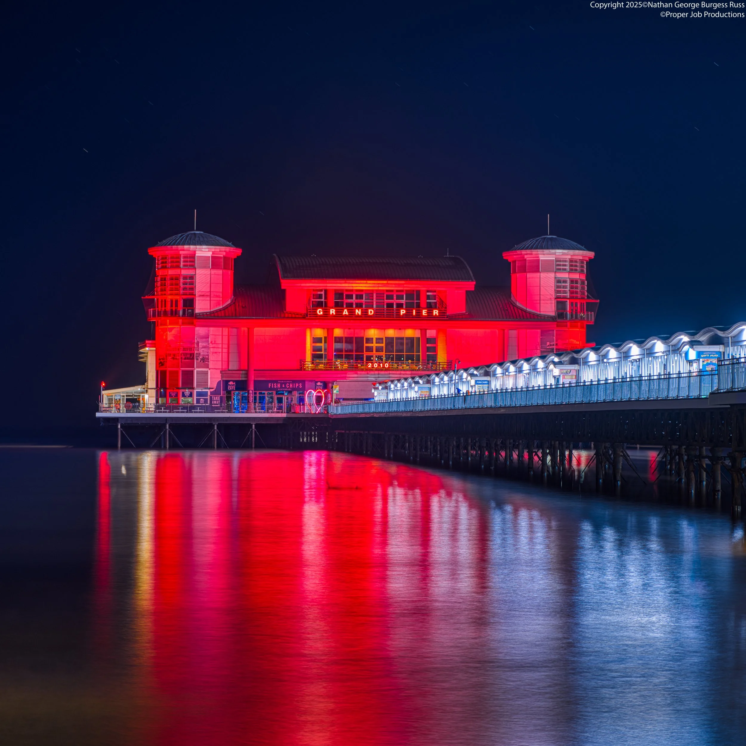 Weston-Super-Mare Grand Pier at night during a King High Tide in spring, also known as a Perigean spring tide.

The Grand Pier is a classic example of late victorian pleasure piers, the Pavillion is the third one built after the first pavillion was d