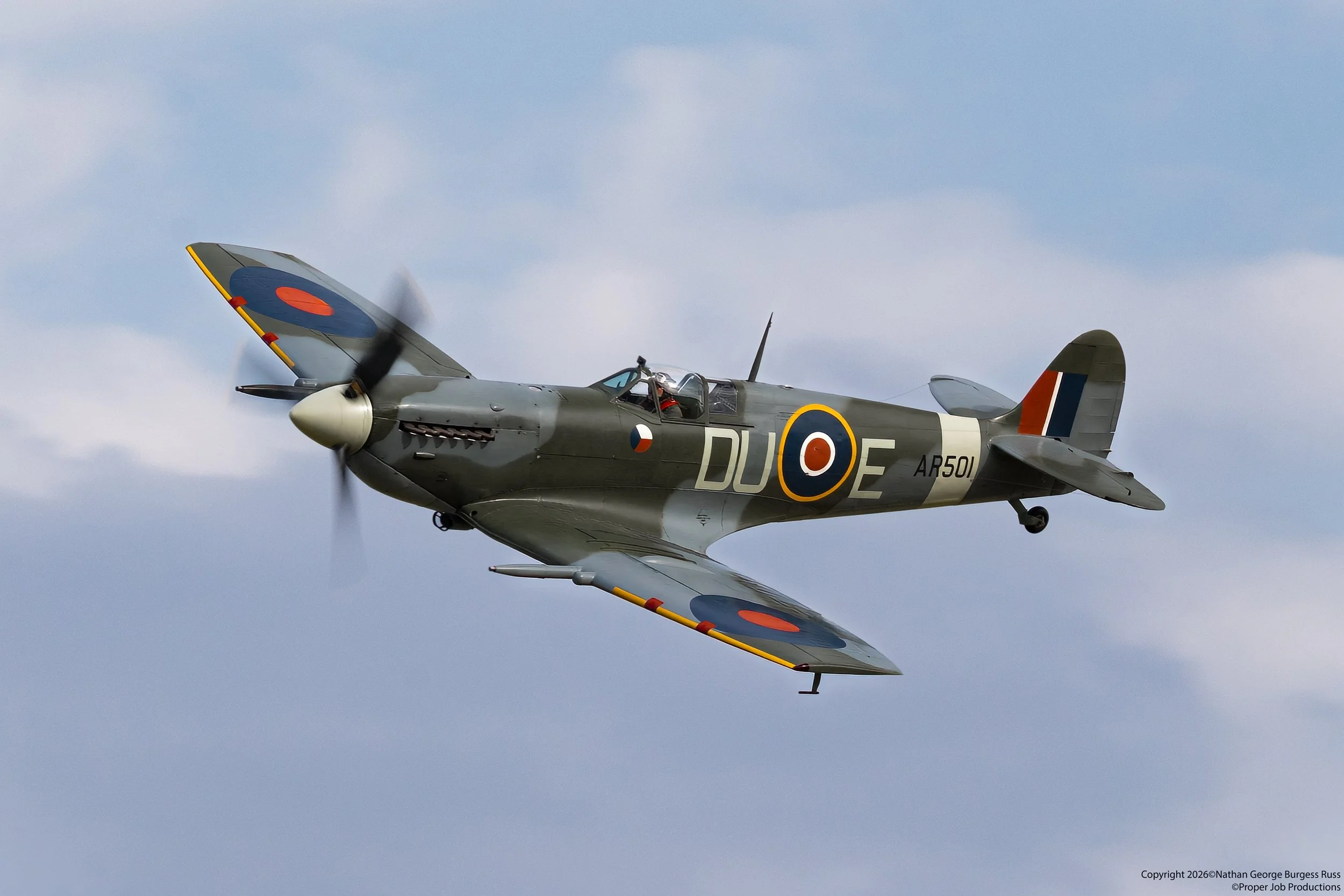 This Supermarine Spitfire MK Vc was built in Yeovil at the Westland Aircraft factory in 1942.  She was issued to No 310 (Czech) Squadron based at Duxford.

While at RAF Duxford she was assigned escort for the United States Army Air Force bombers, inc