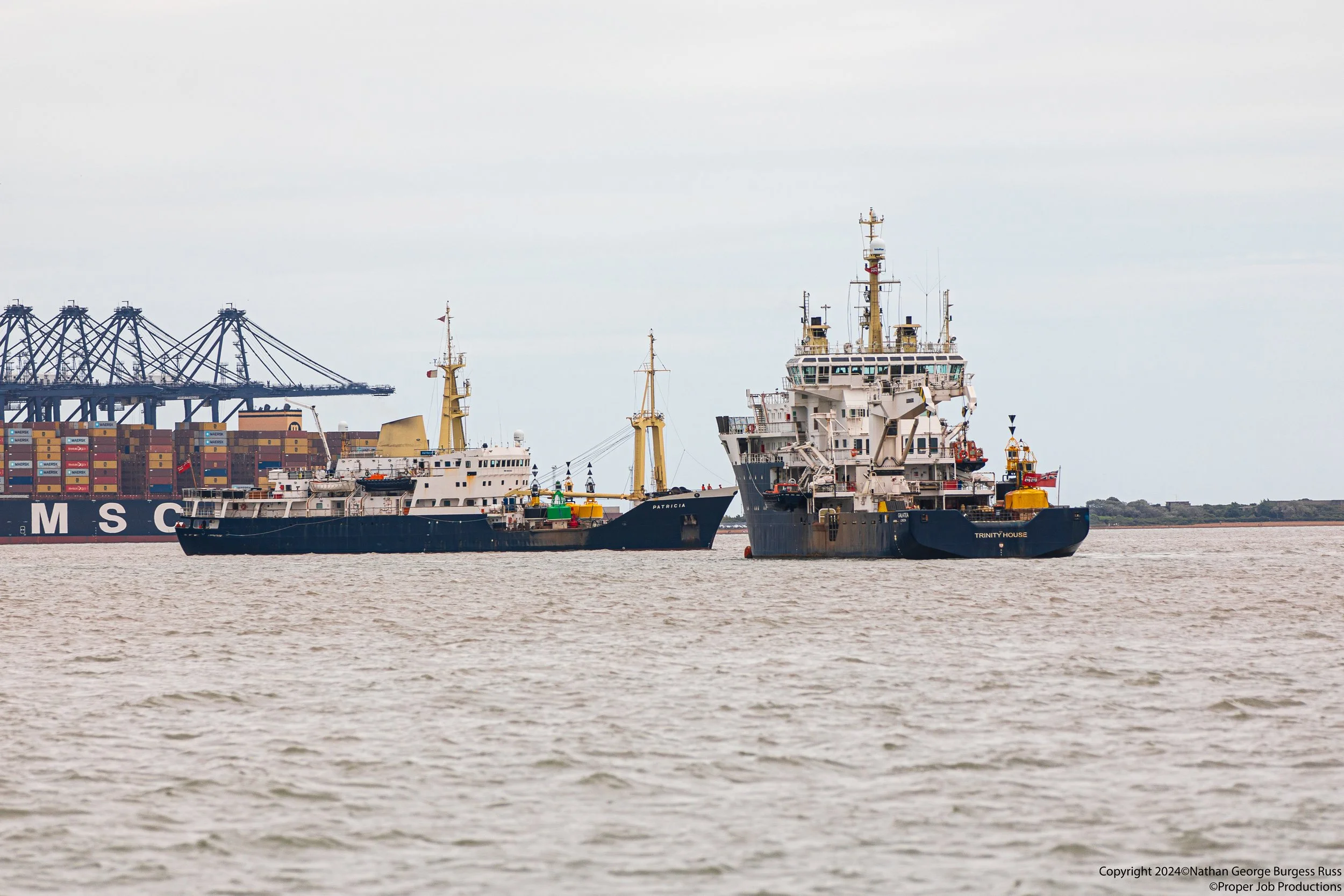 THV Patricia passing the THV Galatea with Felixstowe port Landguard Terminal in the background.

THV Patricia is a Multi-functional Tender (MFT) built for Trinity House in 1982 and used for laying buoys, towing, some surveying and sciencific missions