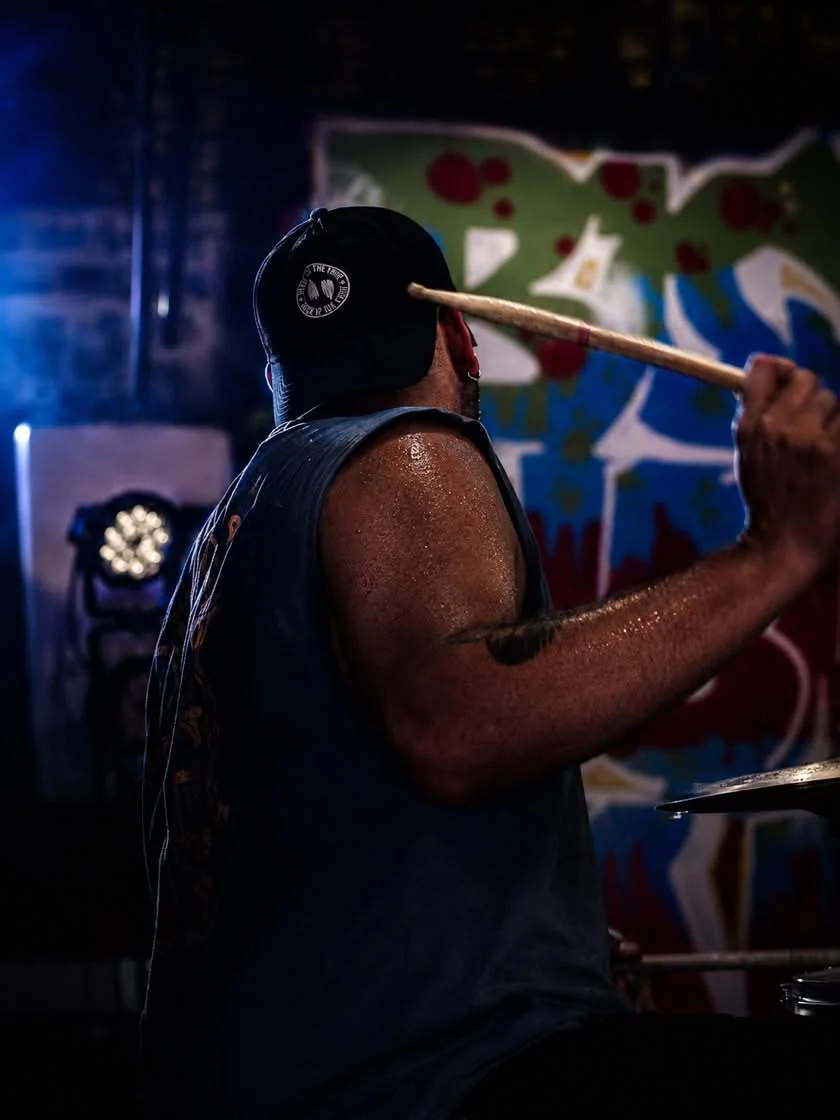 PH Teixeira in motion during a live drum performance