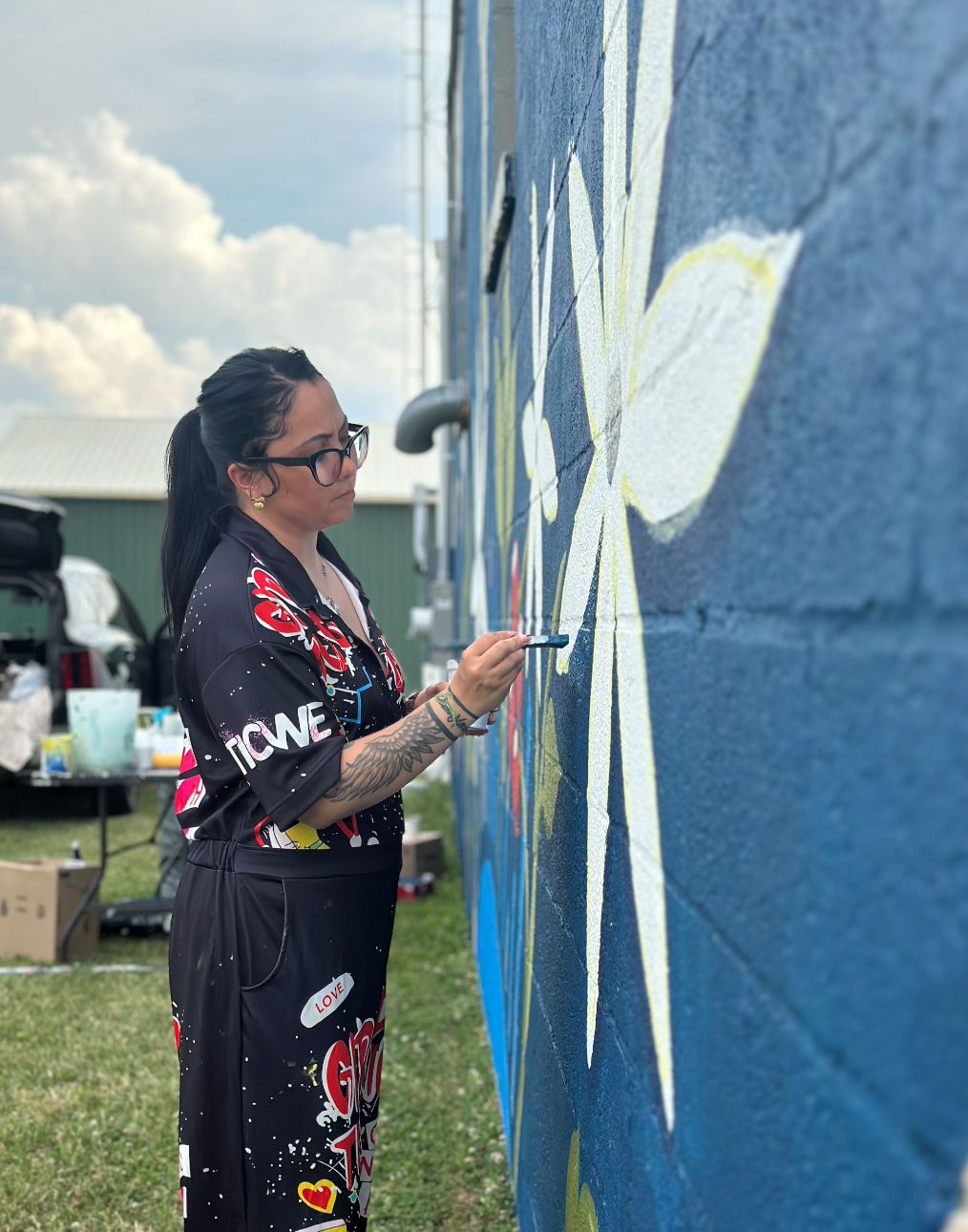 Miriam Moran Painting Amity Community Mural with We Are Limitless Studios