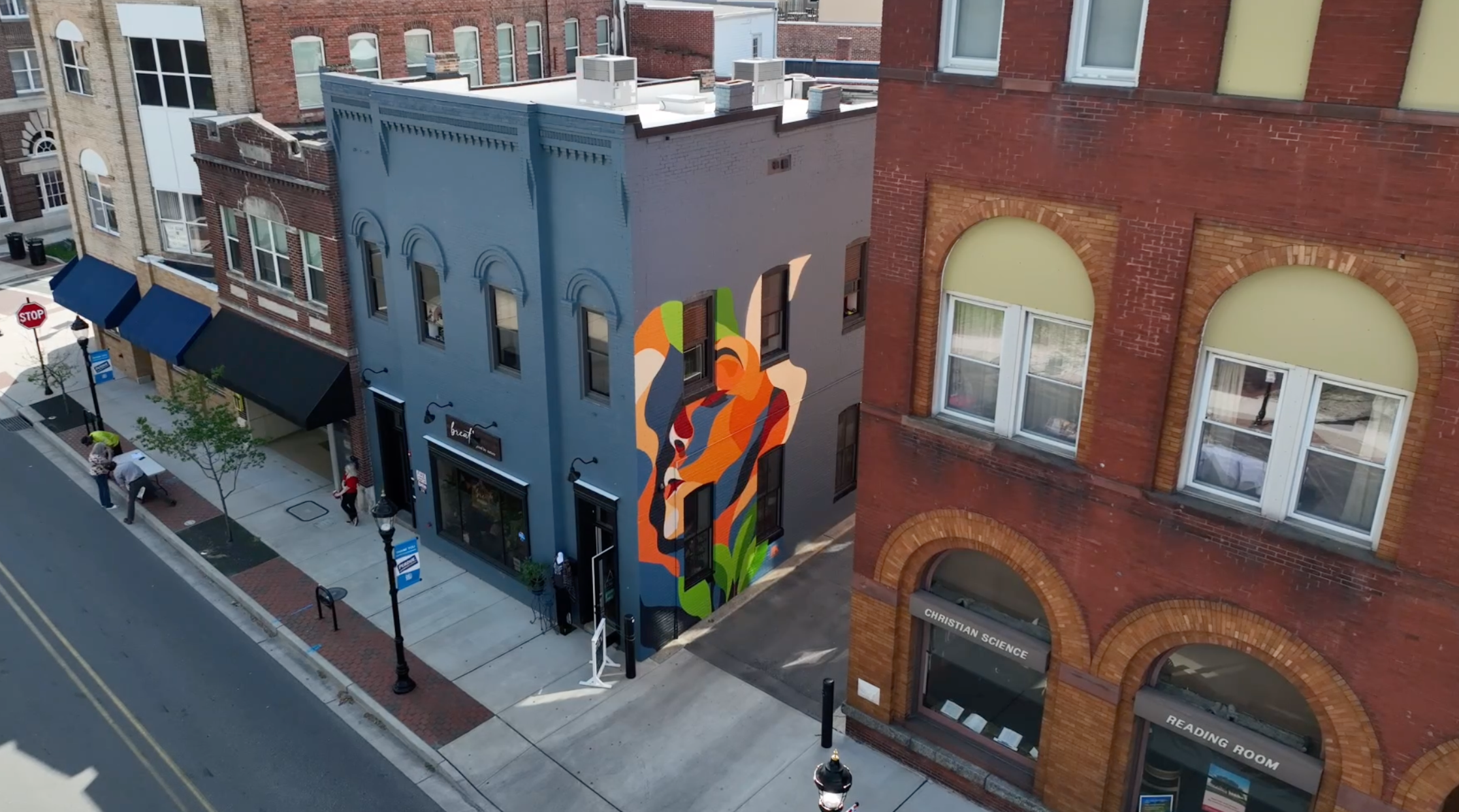 Aerial view of the BREATHE mural painted on a downtown Salisbury building by We Are Limitless Studios