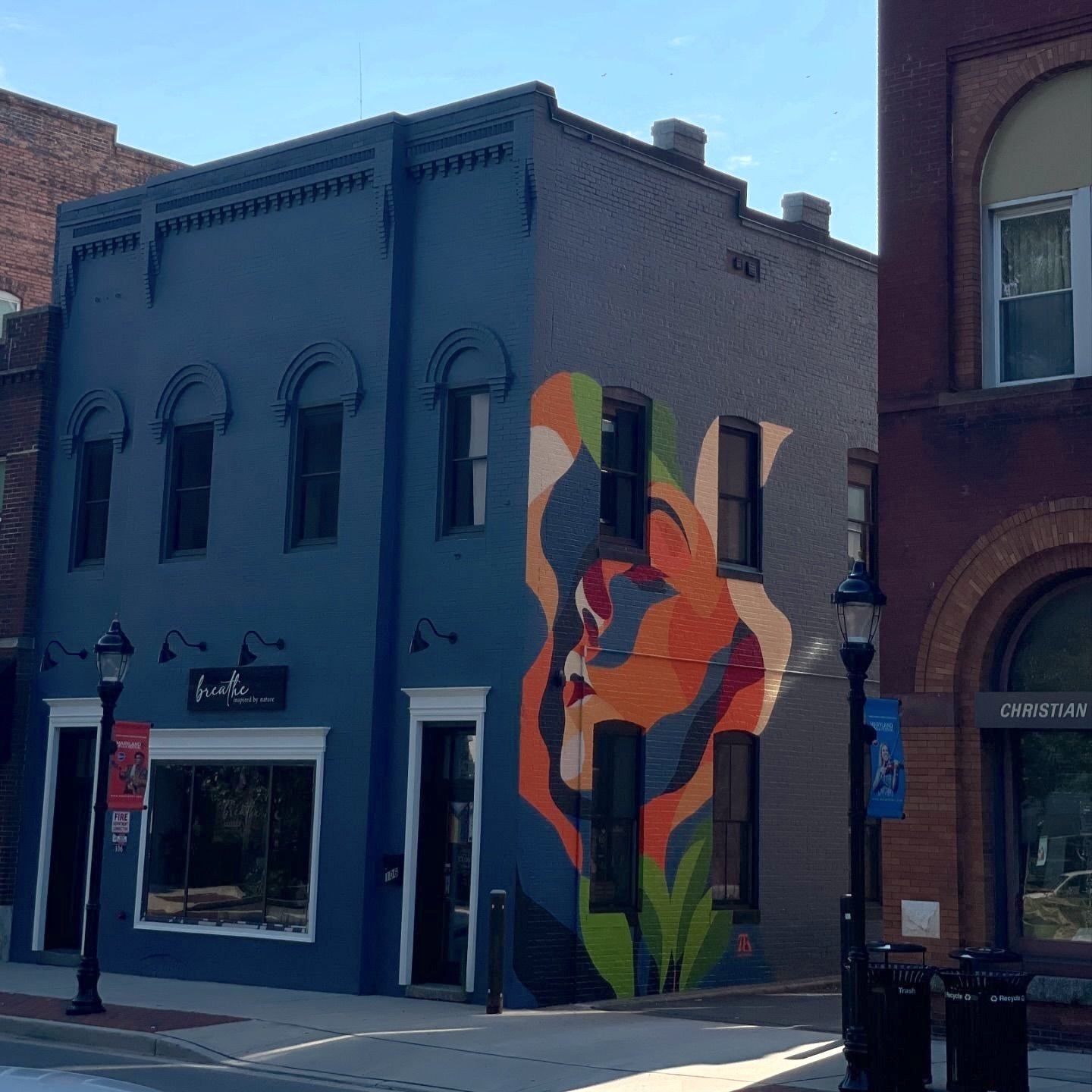 BREATHE mural using the existing building surface as negative space in Downtown Salisbury Maryland