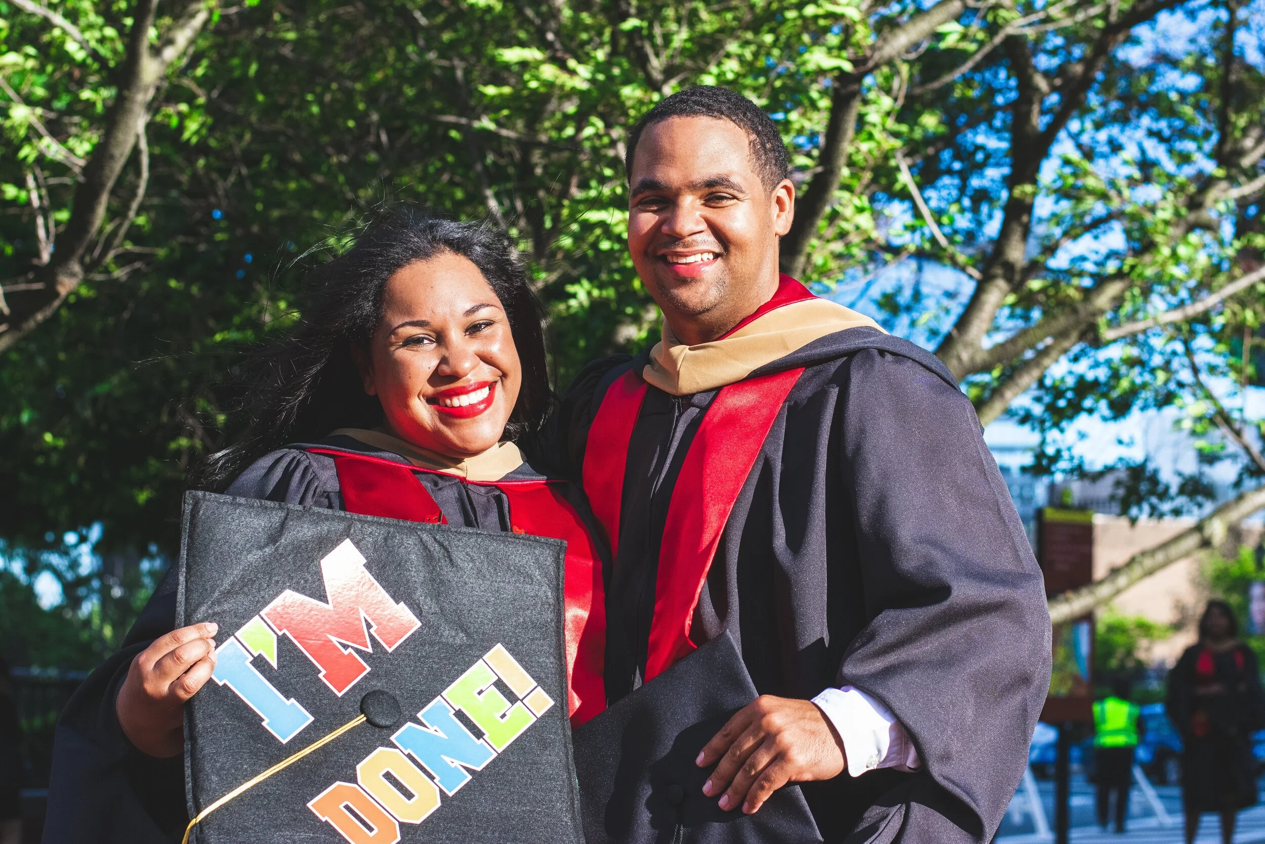 smiling-man-and-woman-beside-trees-2365536.jpg