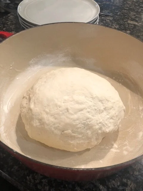 How the dough looks after covering with a towel for 2 hours. Also - your dutch oven should be lined with parchment paper. I forgot to take a picture of that step!