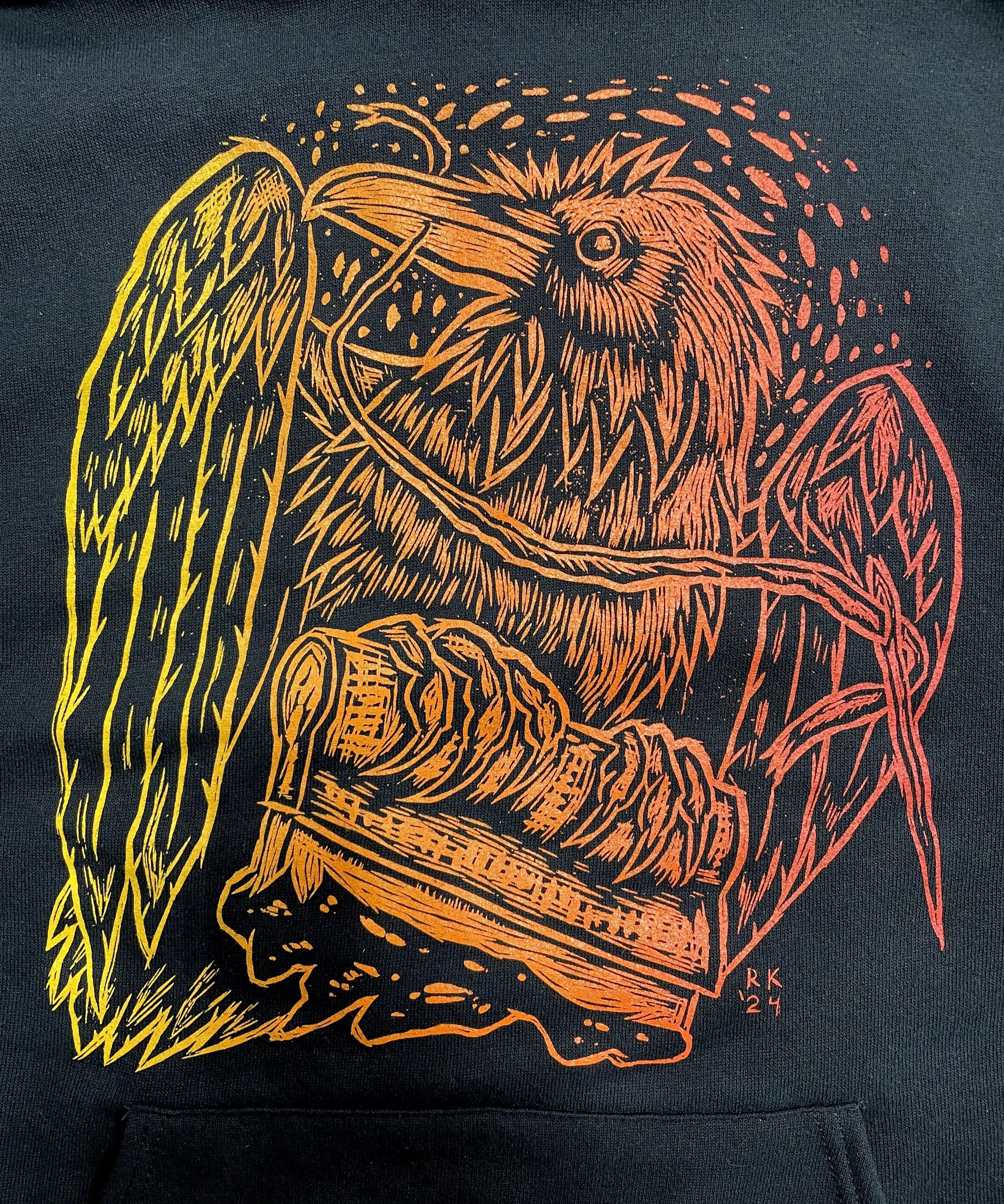  Screen printing and embroidering raven design, screen printed with a split-fountain blend, 2024. This one was printed on an old black hoodie. 