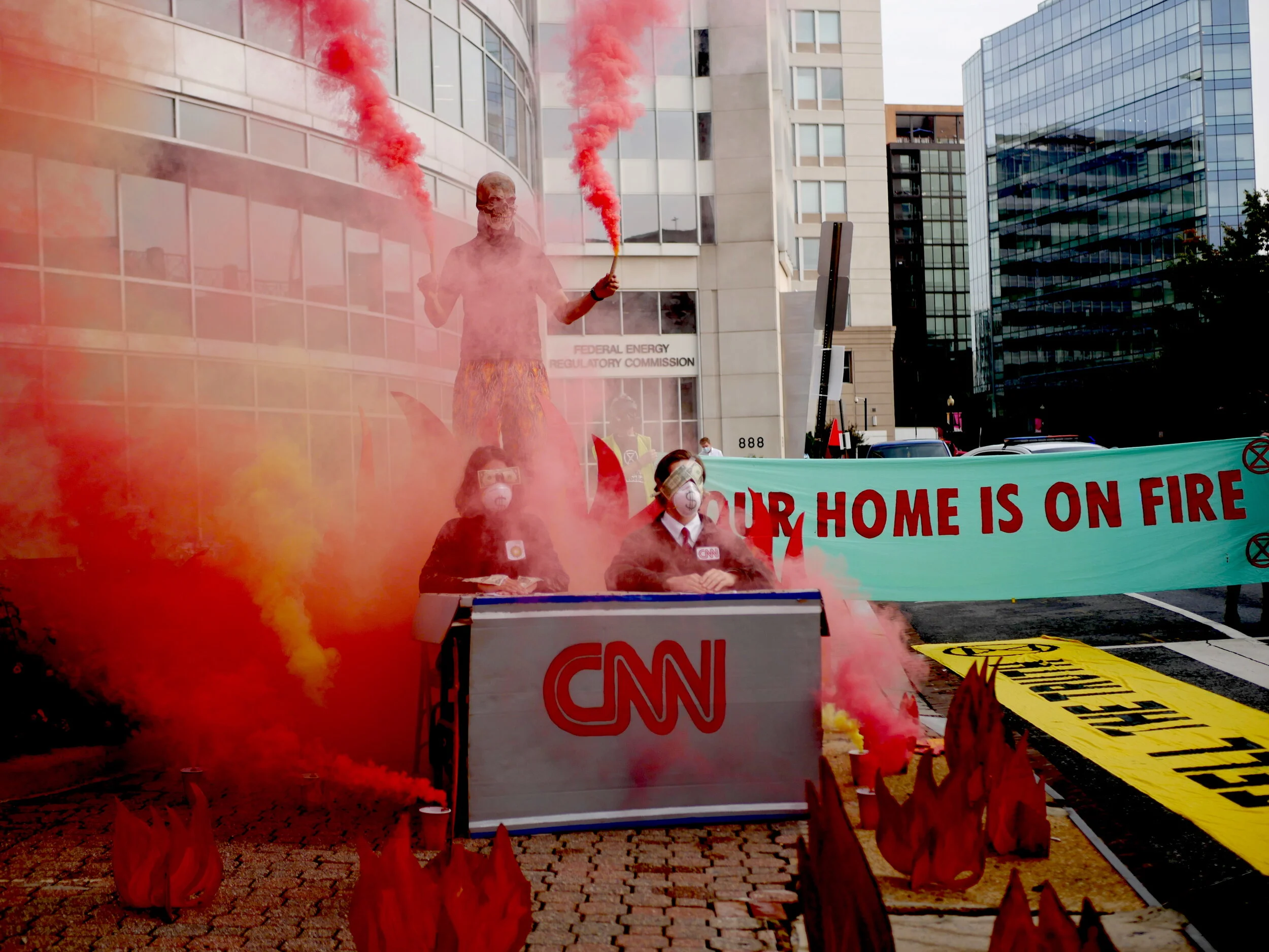 Extinction Rebellion Releases flares in anger at CNN wildfire coverage
