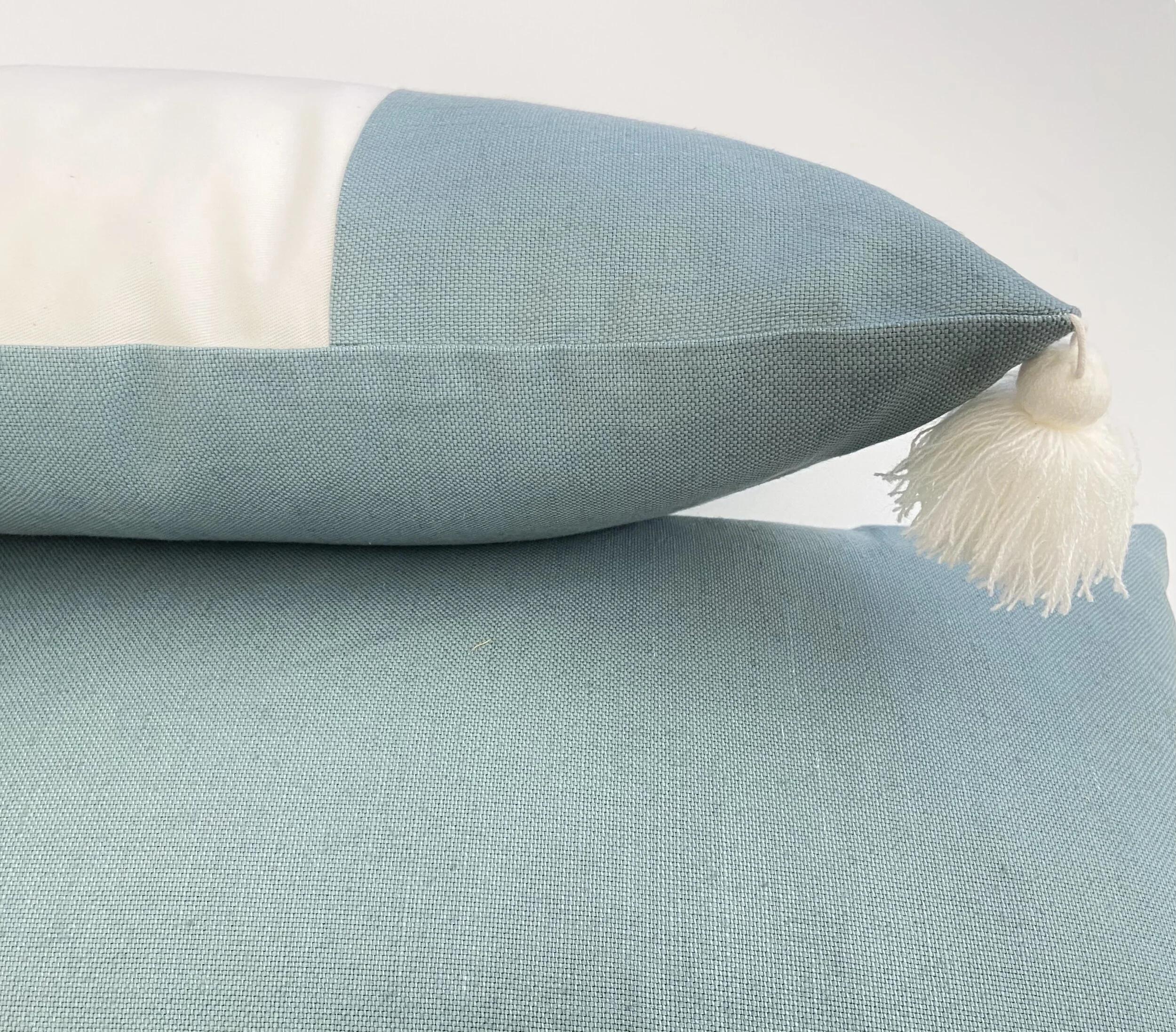 Cream and Teal Color Block Pillow with Tassels