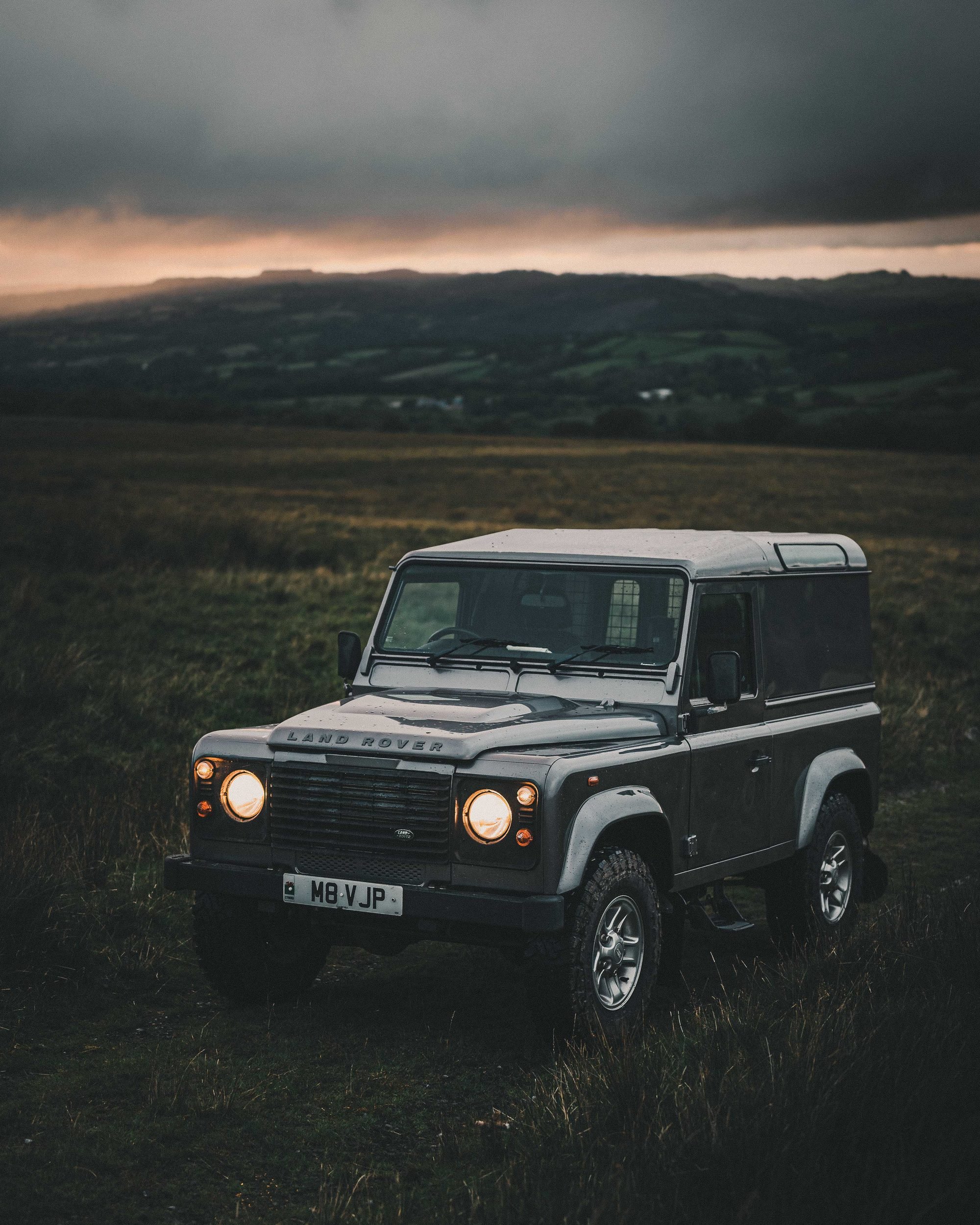 Land Rover Defender on the open moorland at dusk, Bannau Brycheiniog