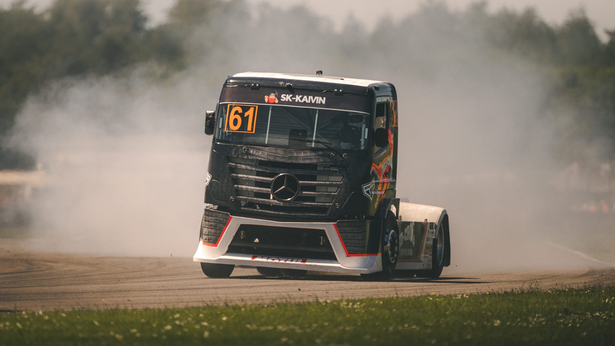 Racing truck sliding through tyre smoke, Pembrey Circuit