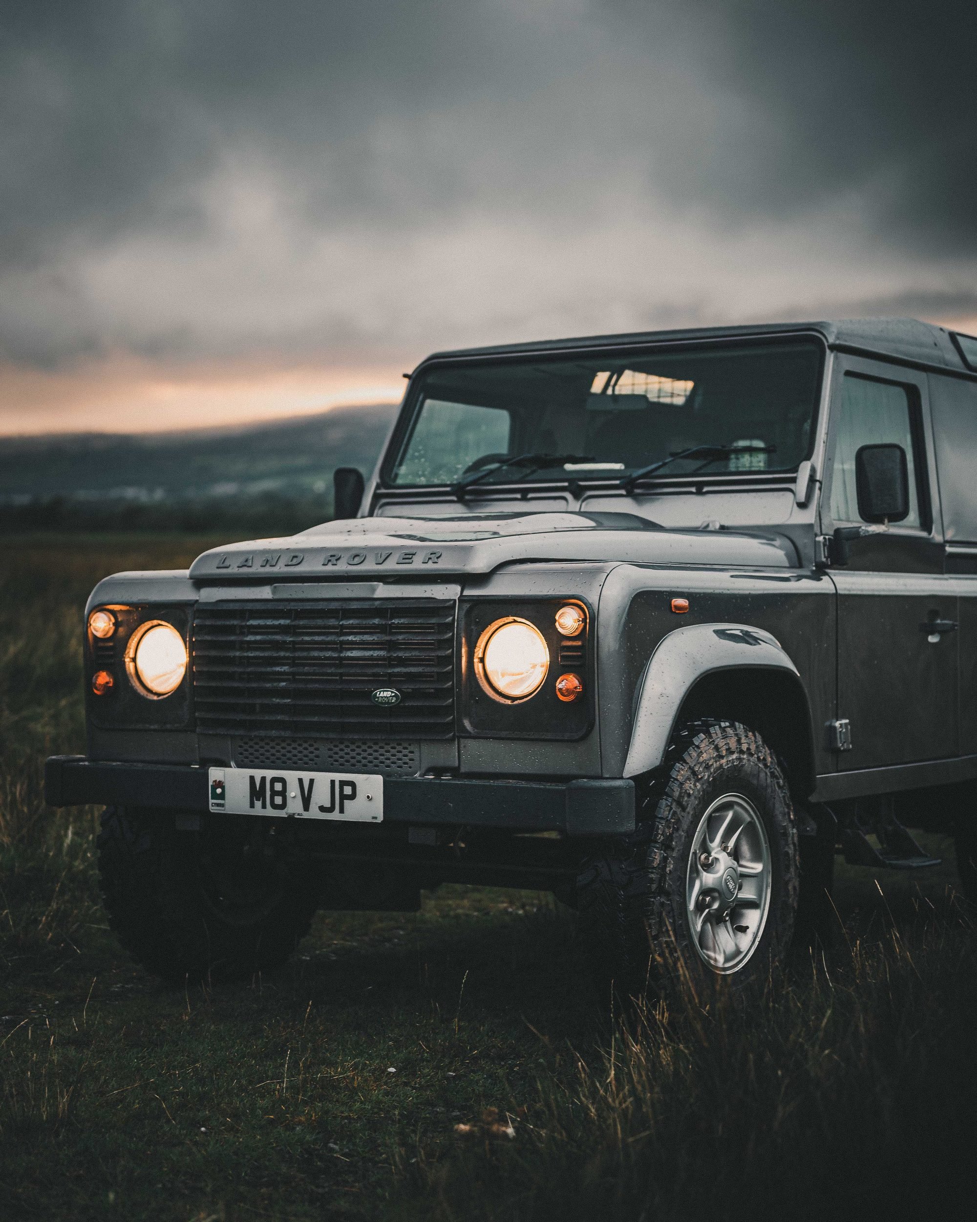 Land Rover Defender at sunset on the moorland, Bannau Brycheiniog