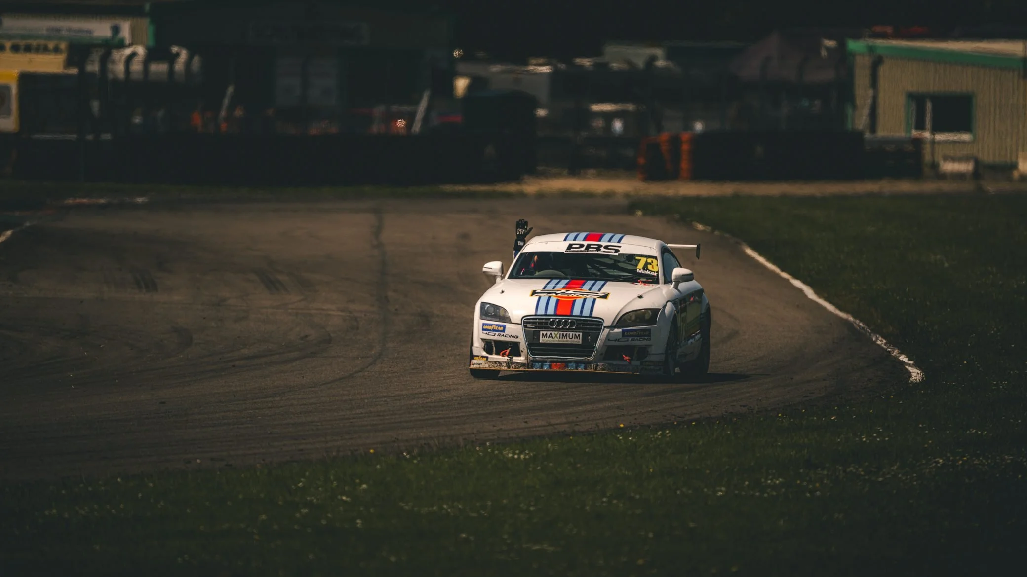 Martini-liveried Audi race car rounding a corner, Pembrey Circuit