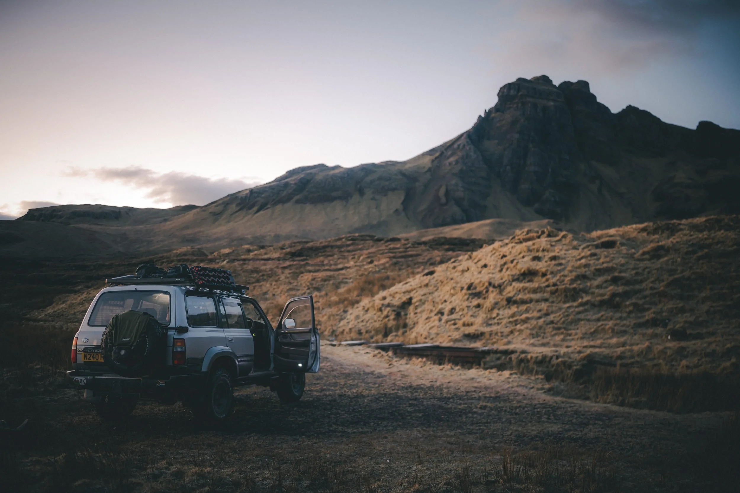 Land Cruiser 80 Series on a mountain track at dusk, Hill of the Red Fox, Isle of Skye