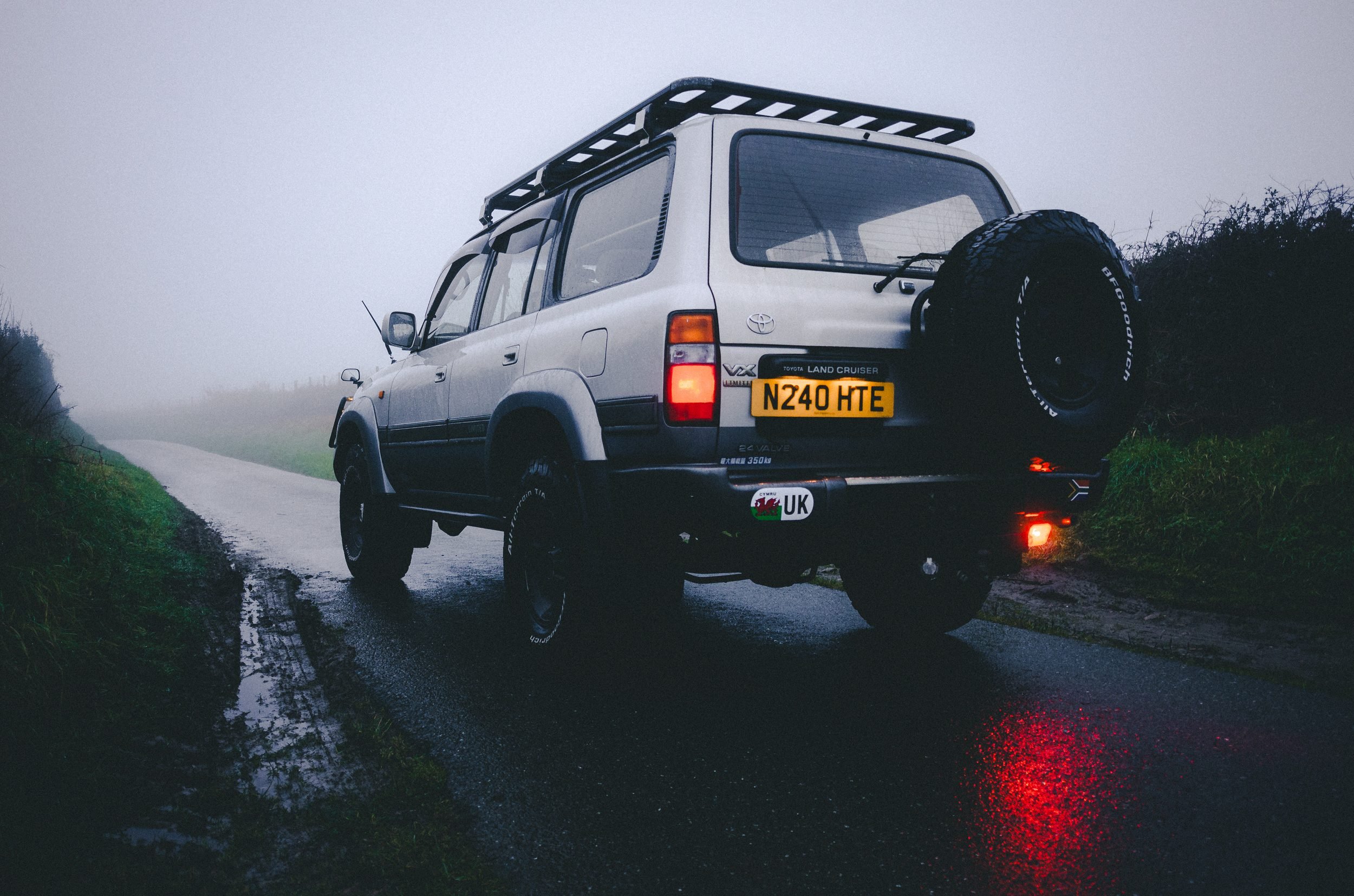 Rear of a Land Cruiser 80 Series on a foggy lane, Carmarthenshire