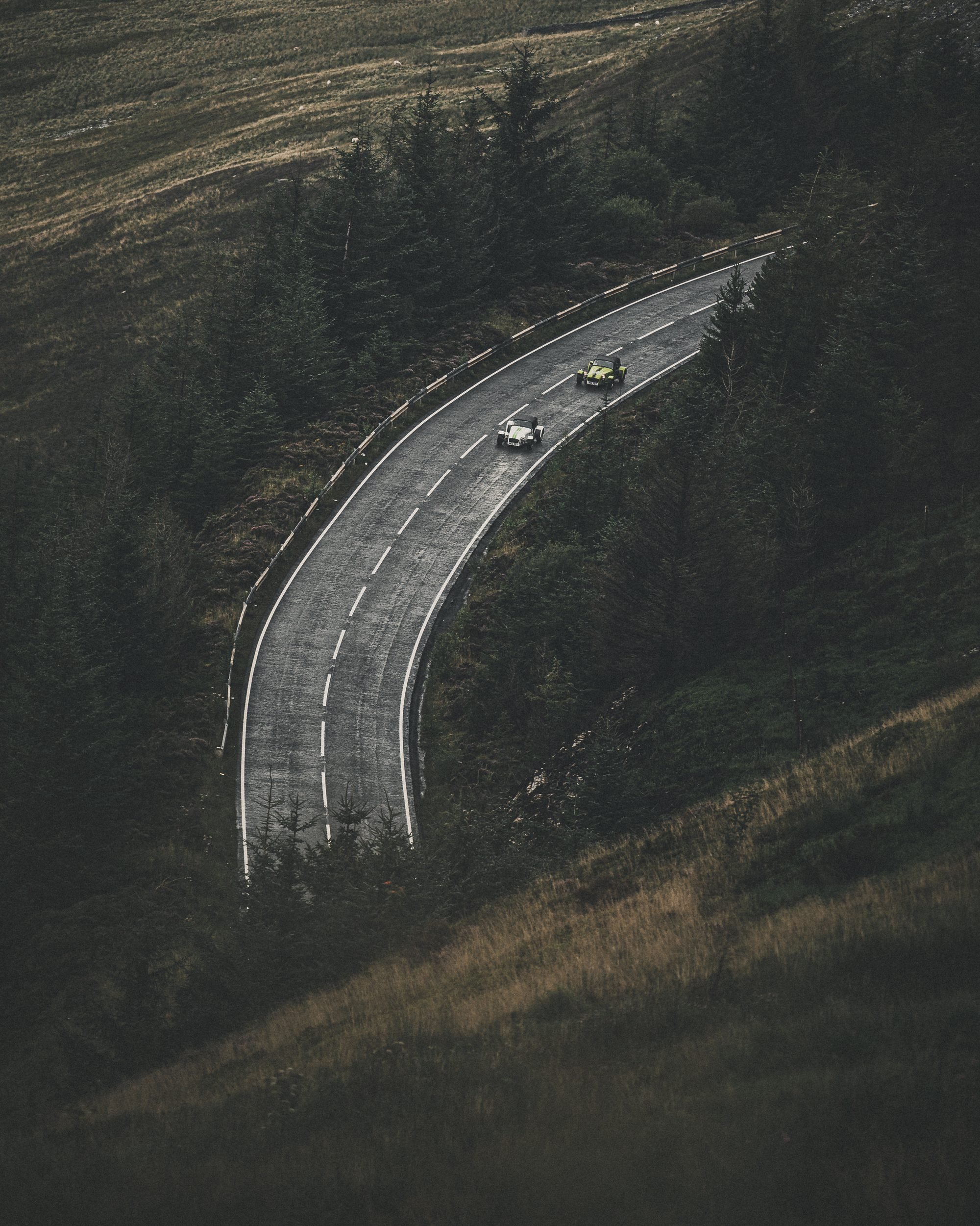 Caterham Sevens on a sweeping mountain road from above