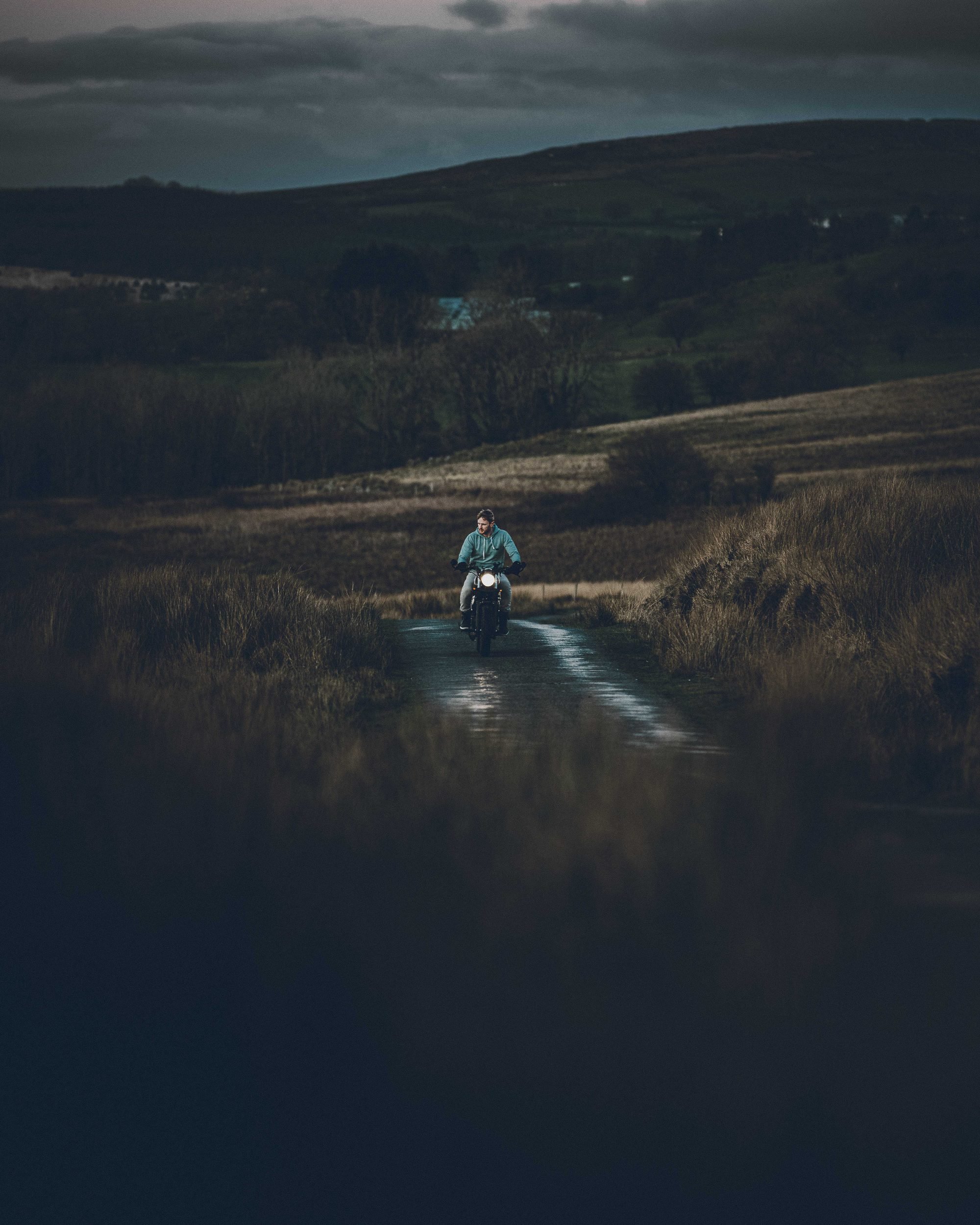 Bullit motorcycle on a wet moorland track, Bannau Brycheiniog