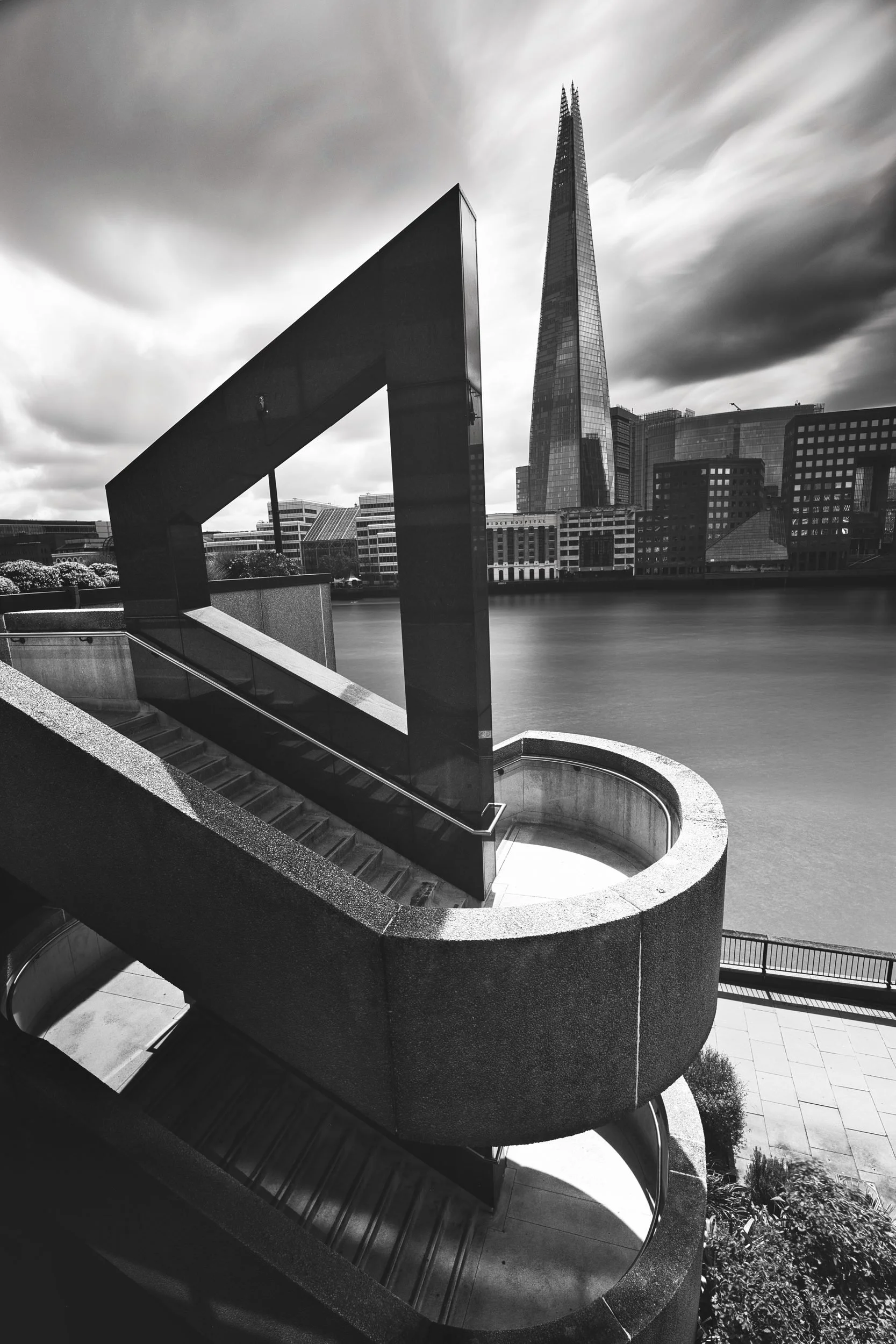 Black and white view of The Shard from a riverside sculpture, London
