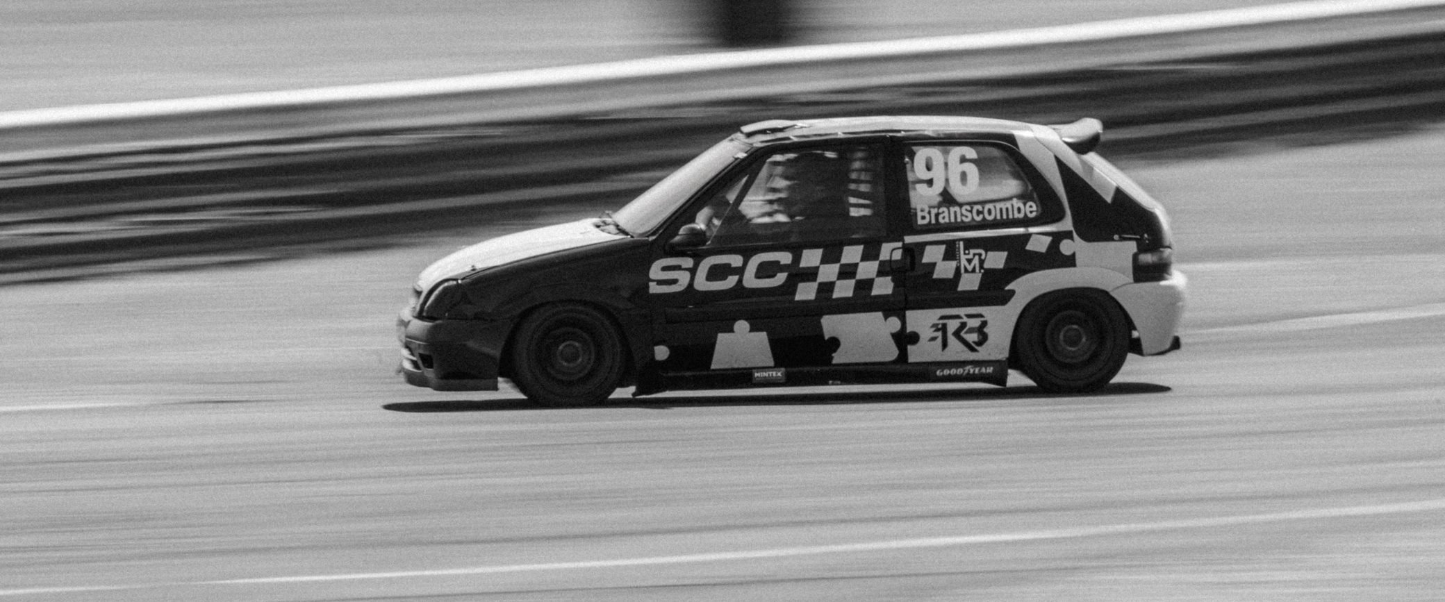 Hatchback race car in black and white, Pembrey Circuit
