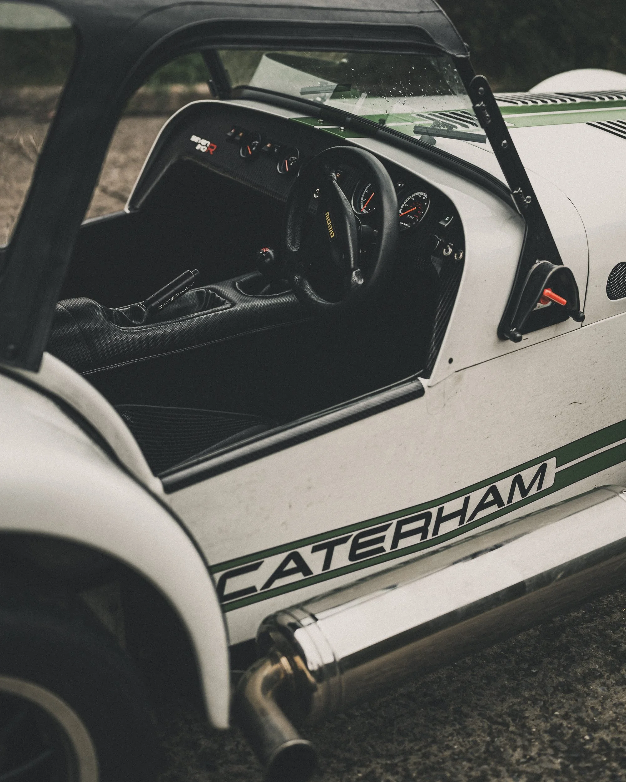 White Caterham Seven with green stripe