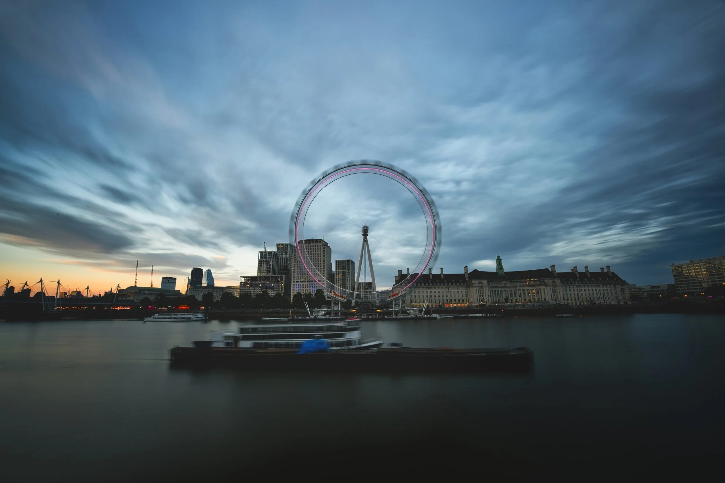 London Eye across the Thames at dusk