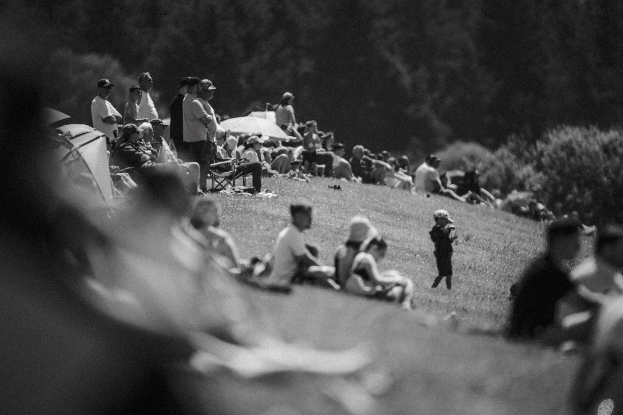 Spectators watching from the bank in black and white, Pembrey Circuit