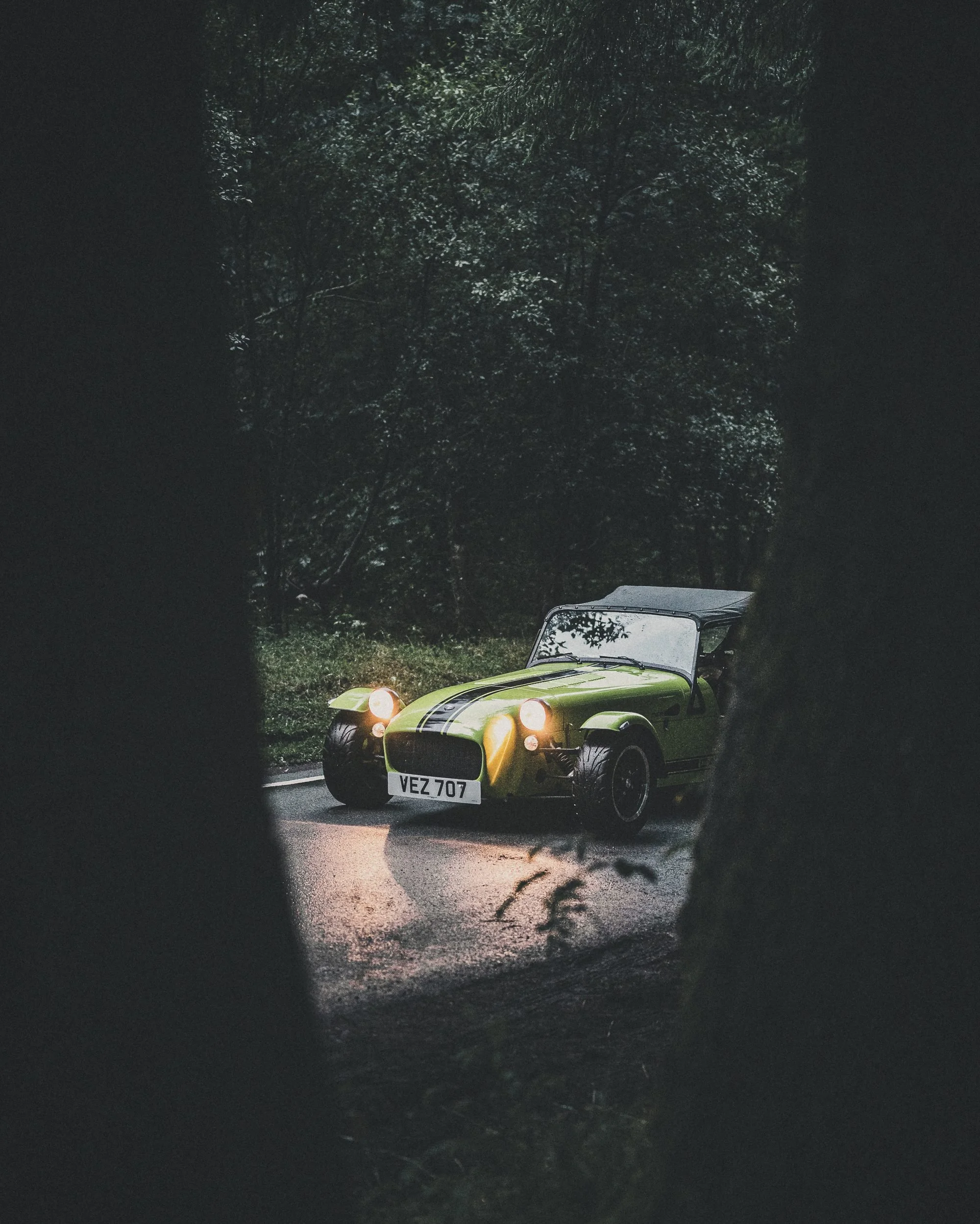 Caterham Seven framed by trees
