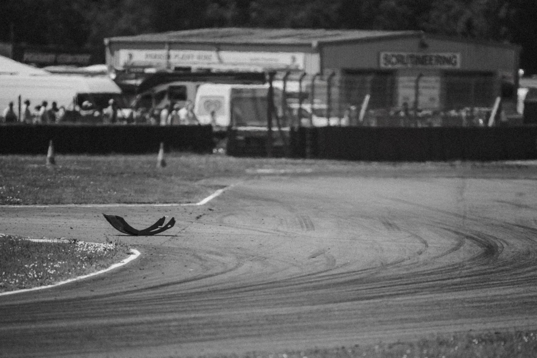 Black and white view along the track and pit buildings, Pembrey Circuit