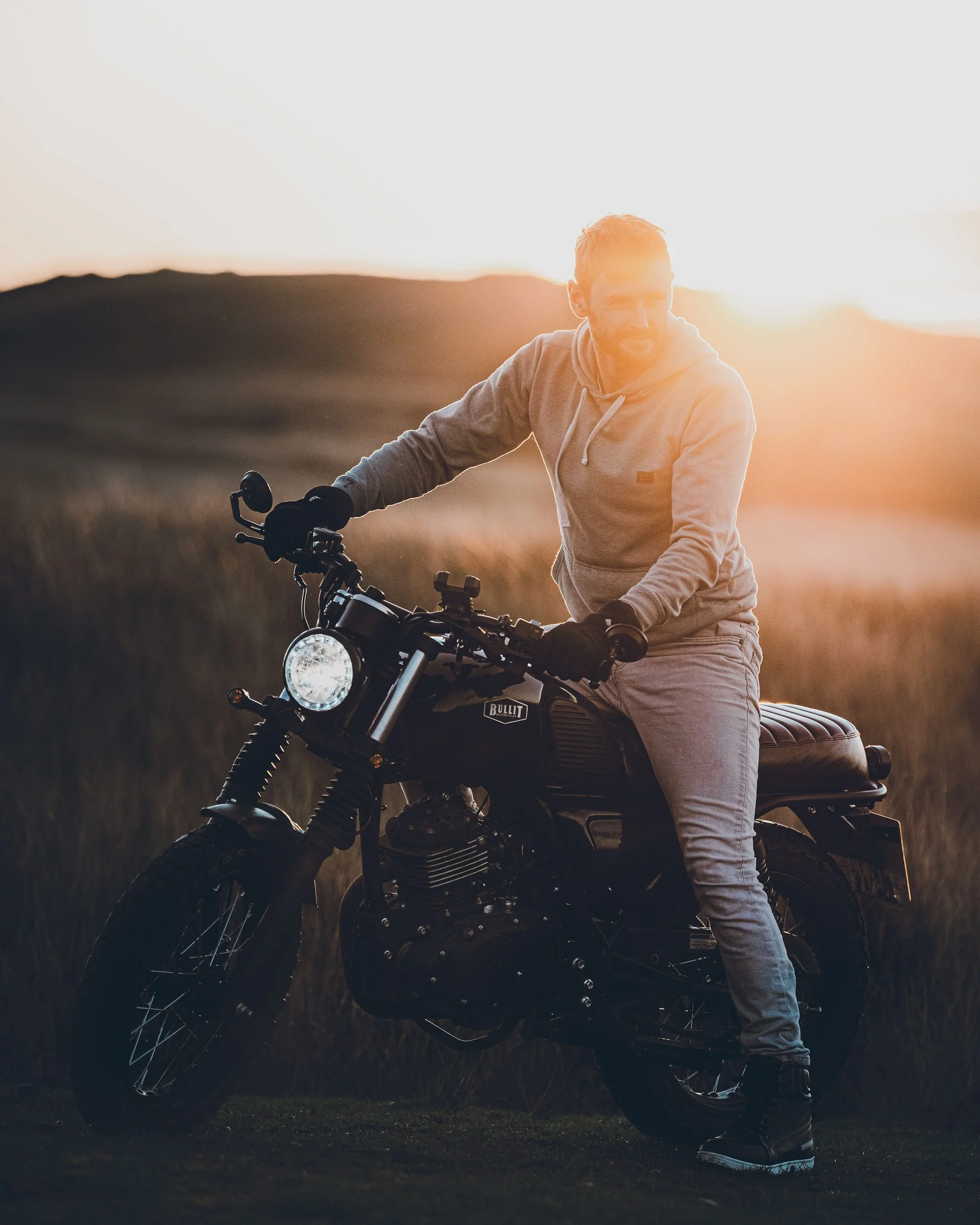Rider on a Bullit motorcycle at sunset, Bannau Brycheiniog