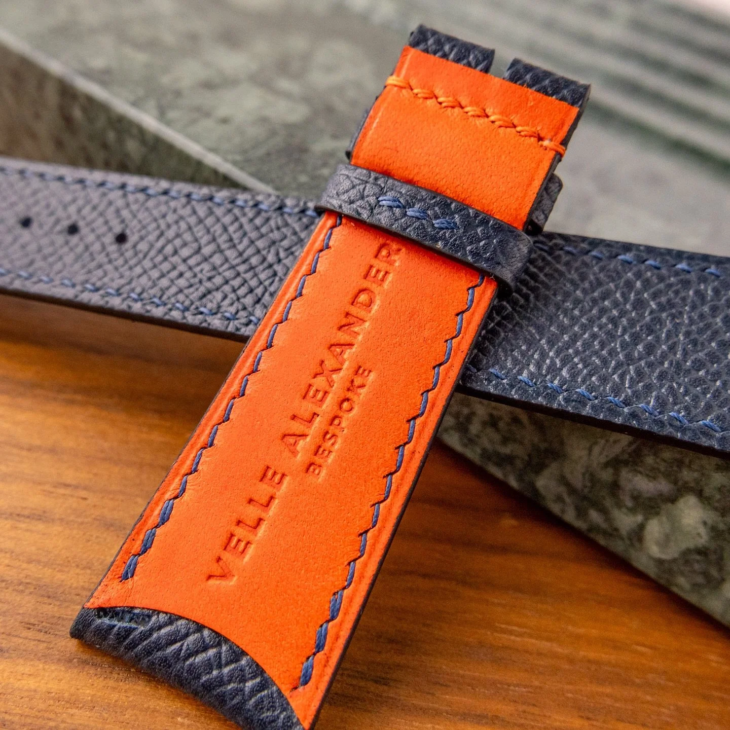 Dark navy French Epsom calfskin with American English bridle “carrot” lining. Curved ends and accented orange buckle stitch for a client’s IWC Portugieser #iwcportugieser