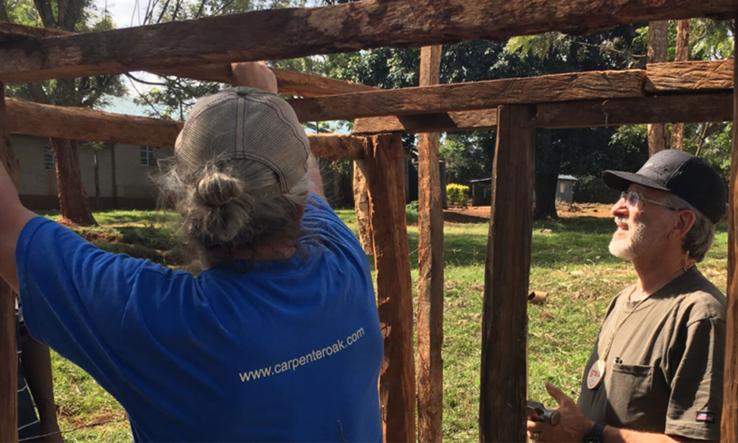   TGE volunteers work to construct a water tower during Week One of the 2018 Project Trip.  