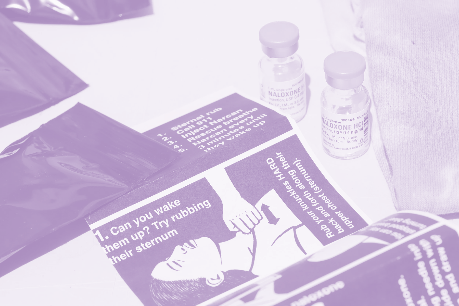 Overdose reversal pamphlet and intramuscular Naloxone vials linking to the OD Reversal Report Form page.