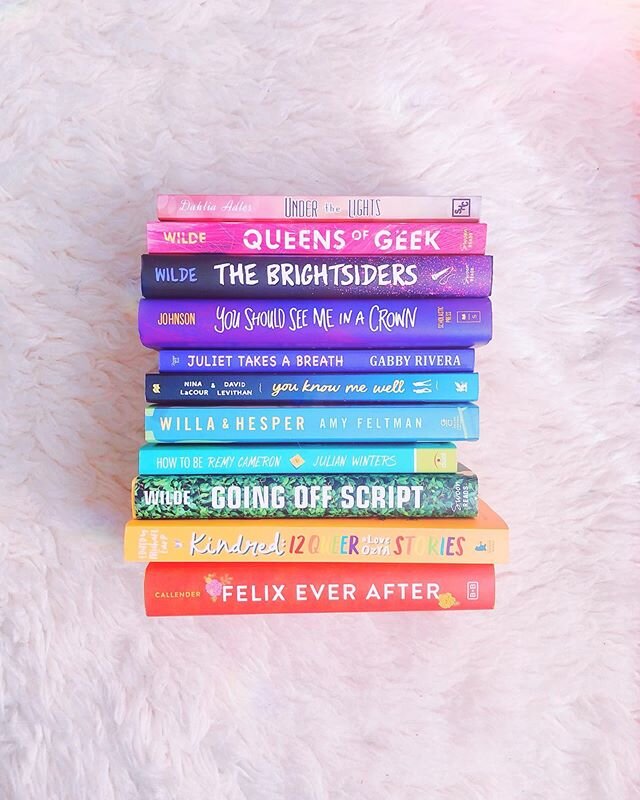 here&rsquo;s a little book rainbow to remind you that it&rsquo;s the last day to enter my pride giveaway for HOW TO BE REMY CAMERON! Head over to my profile to enter 🌈🌈🌈
