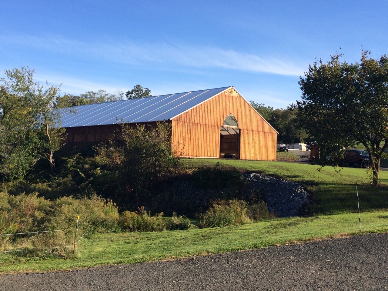 A custom 70’ x 158’ fabric roof wooden riding arena in Ashford, Connecticut.