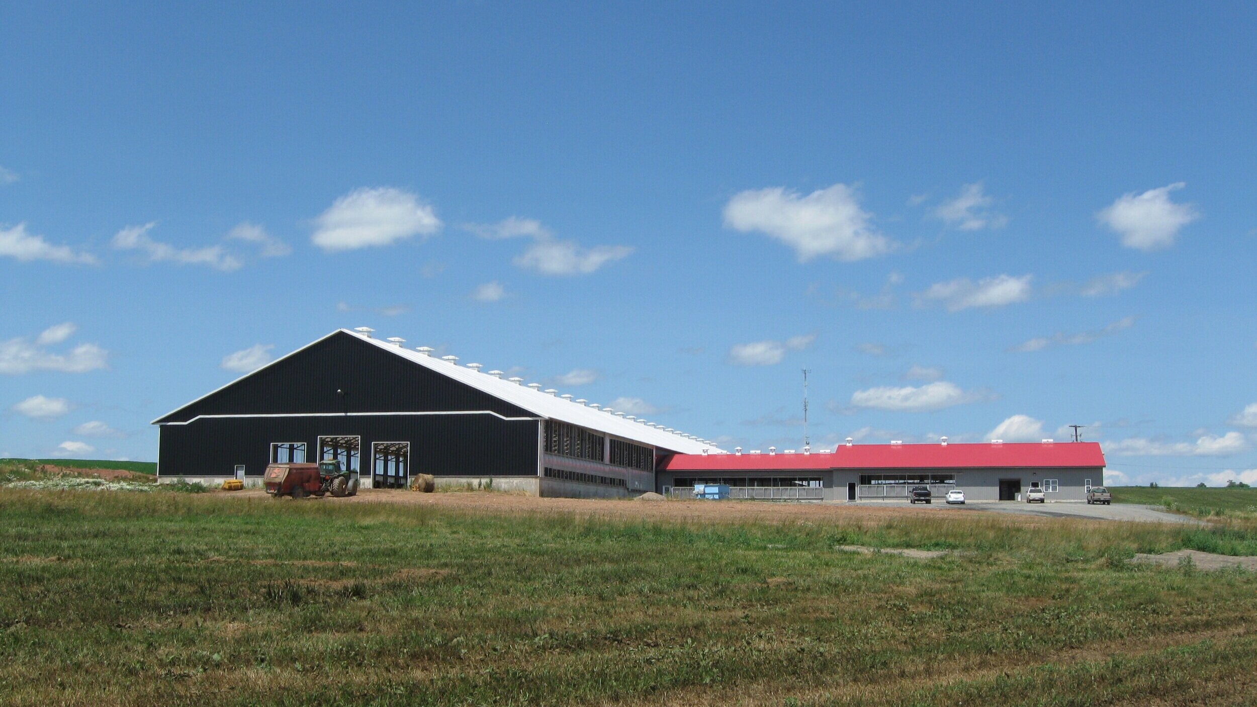 A custom 130’ x 600’ fabric roof metal frame dairy barn in Shubenicadie, Nova Scotia.