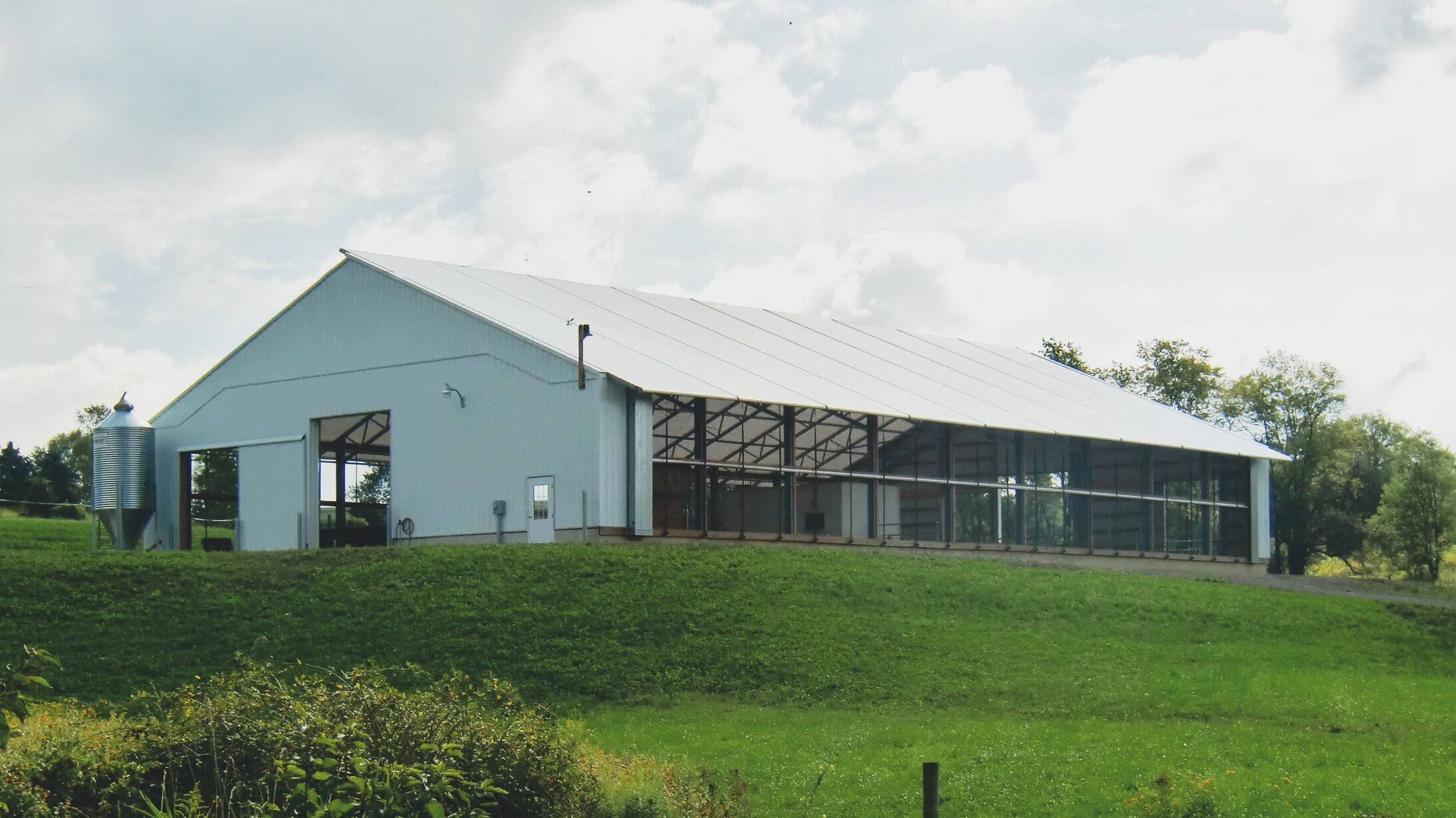 A custom 65’x 108’ fabric roof metal calf barn in Summerhill, Pennsylvania. 